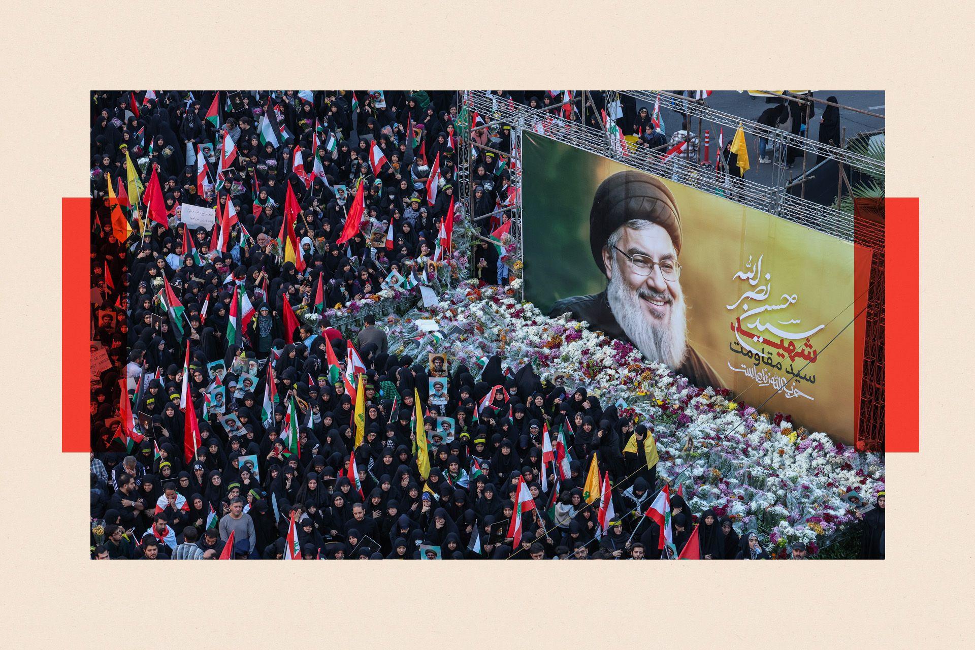 Iranians lay flowers beneath a billboard bearing a portrait of Hassan Nasrallah