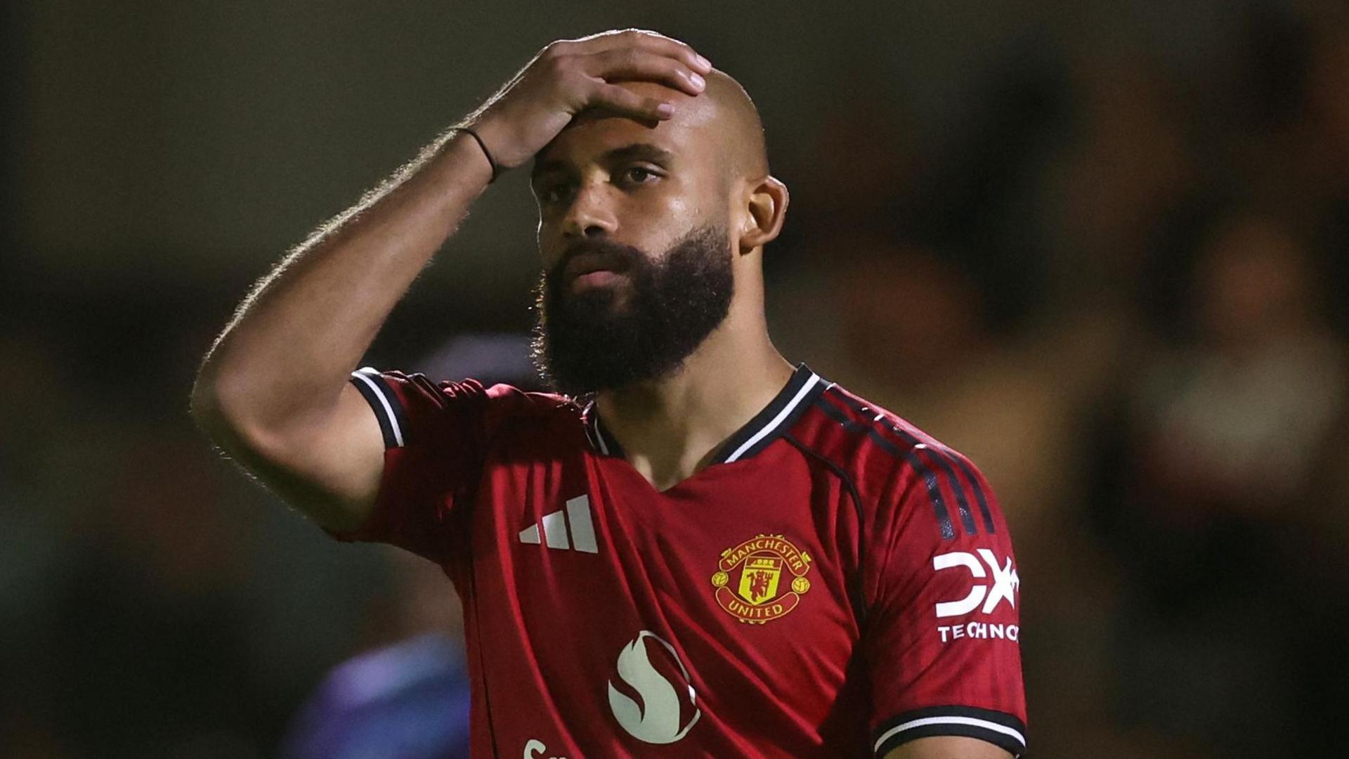 Bryan Mbeumo holds his hand to his head after Manchester United lose to Grimsby