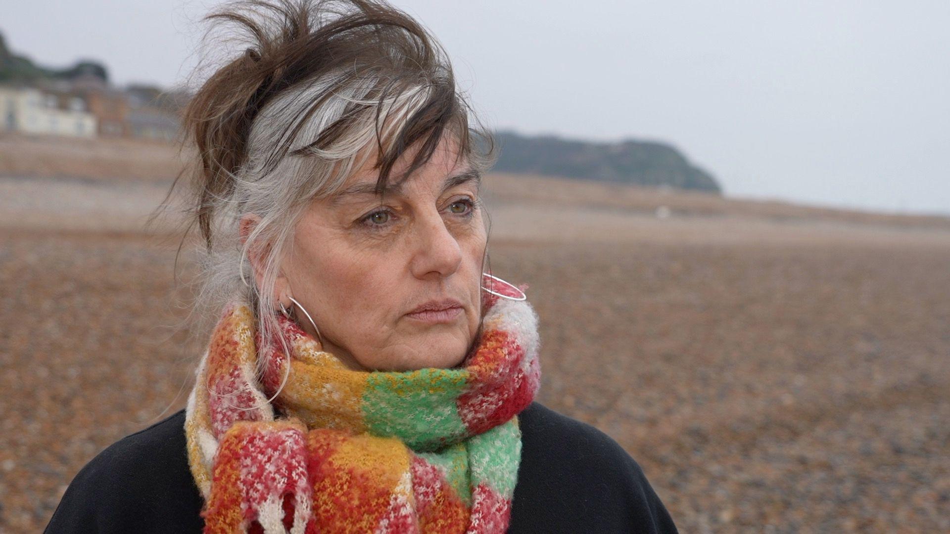 Rebecca Sinker on a beach