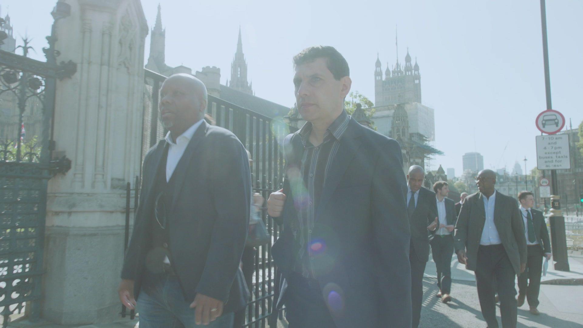 Alex Sobel MP and Rod Wallace stepping successful beforehand of nan Houses of Parliament. 