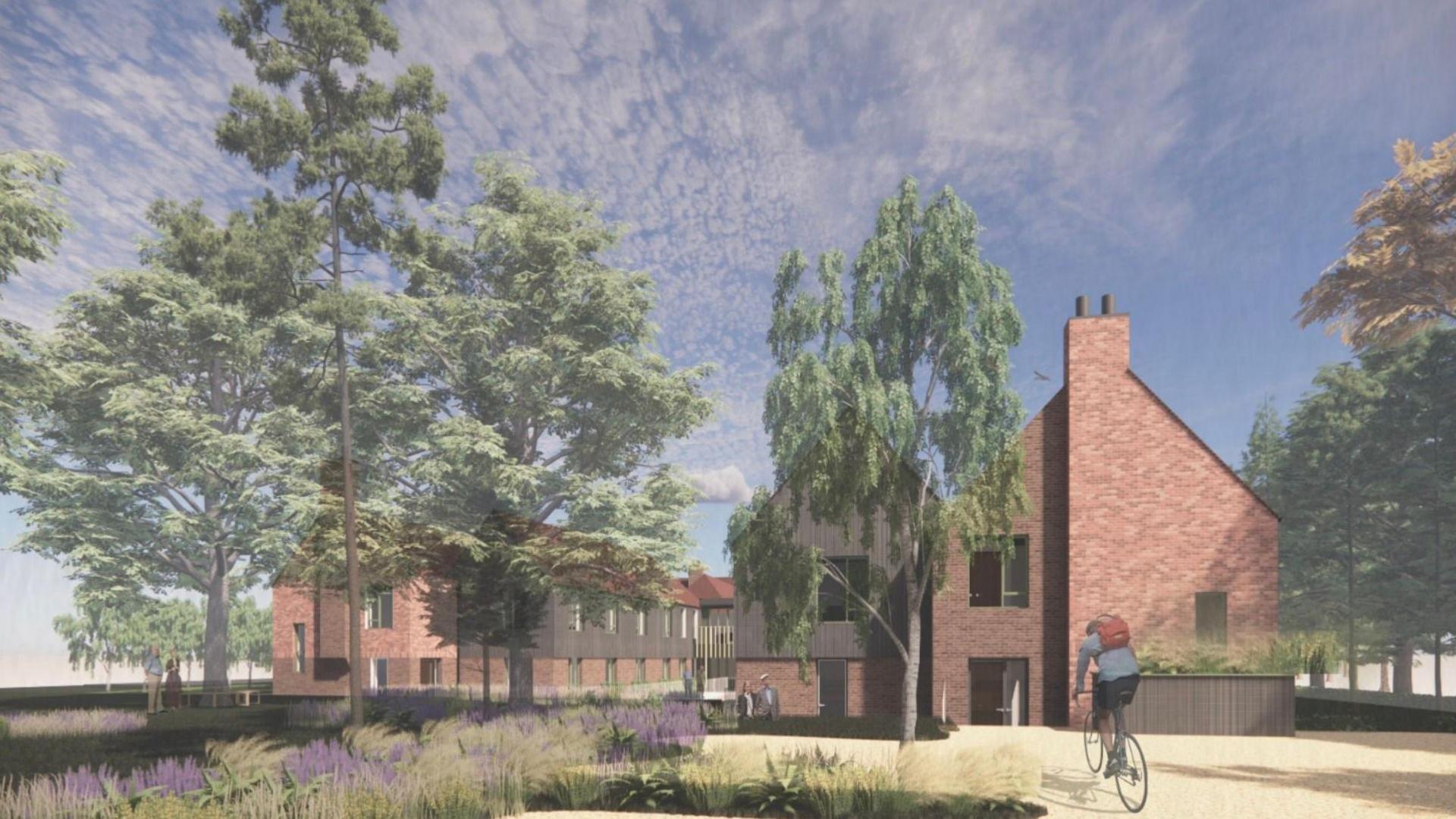 An artist's impression of a new care home planned for a development at Deepcut, showing trees, buildings and a person cycling towards them.