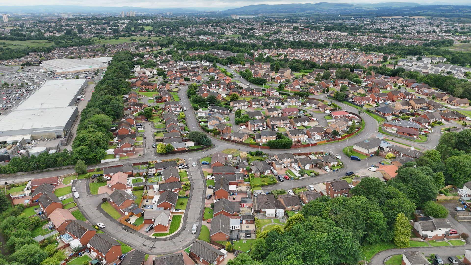 An aerial view of the Robroyston area of Glasgow, showing dozens and dozens of houses