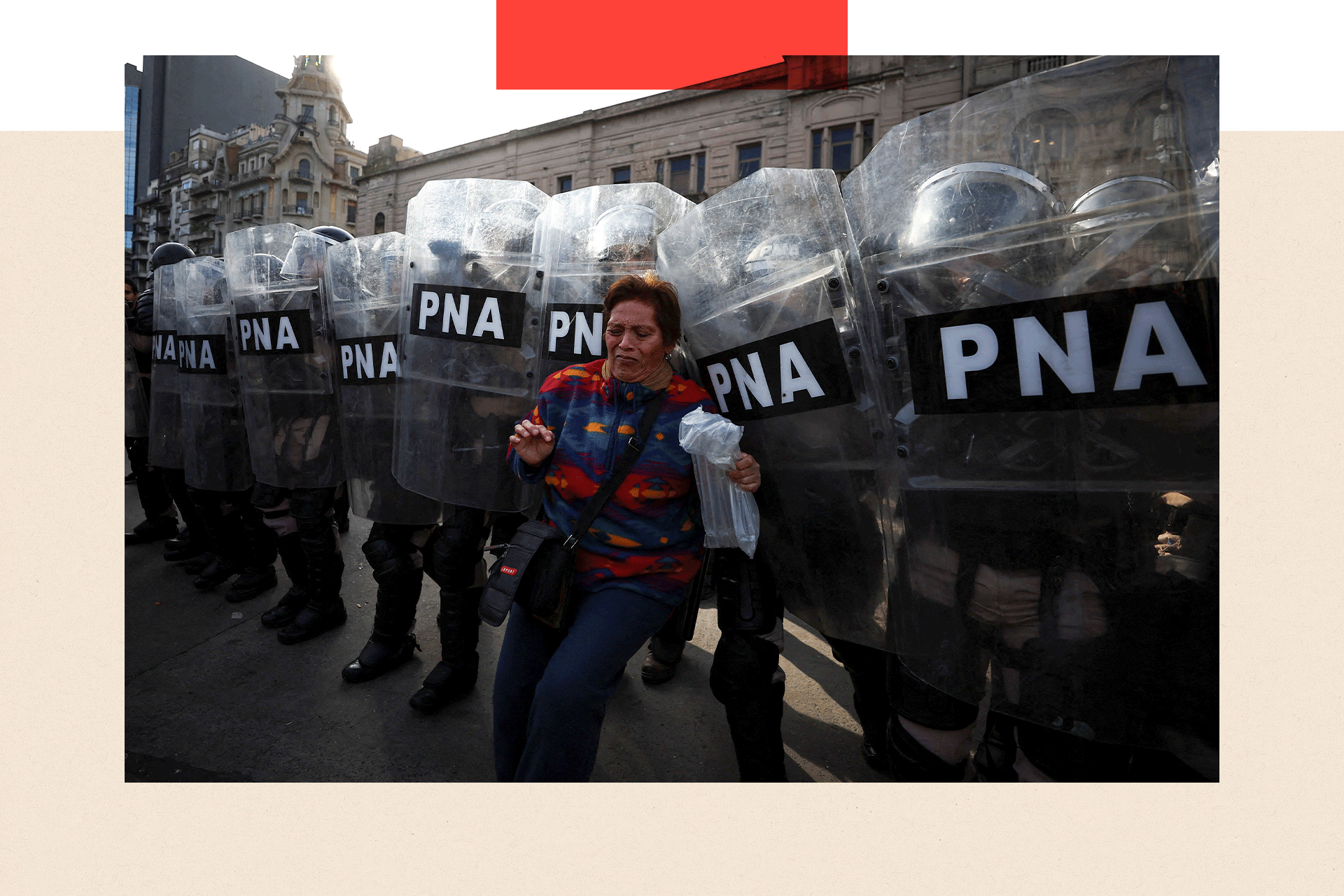 A woman and members of the Argentine Naval Prefecture during a protest against Argentina's President Javier Milei