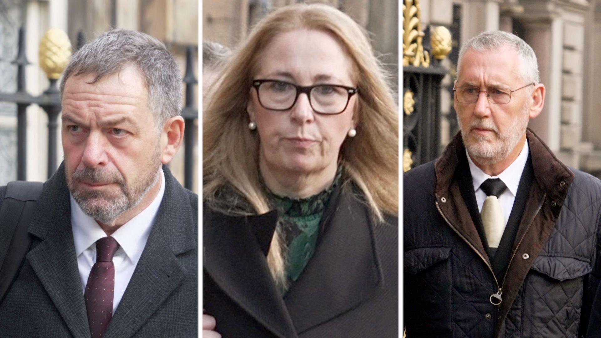 A man in a white shirt, red tie and grey coat alongside a woman with blonde hair in a green top and black coat and a man in a black coat and tie, all stern-faced outside a town hall building