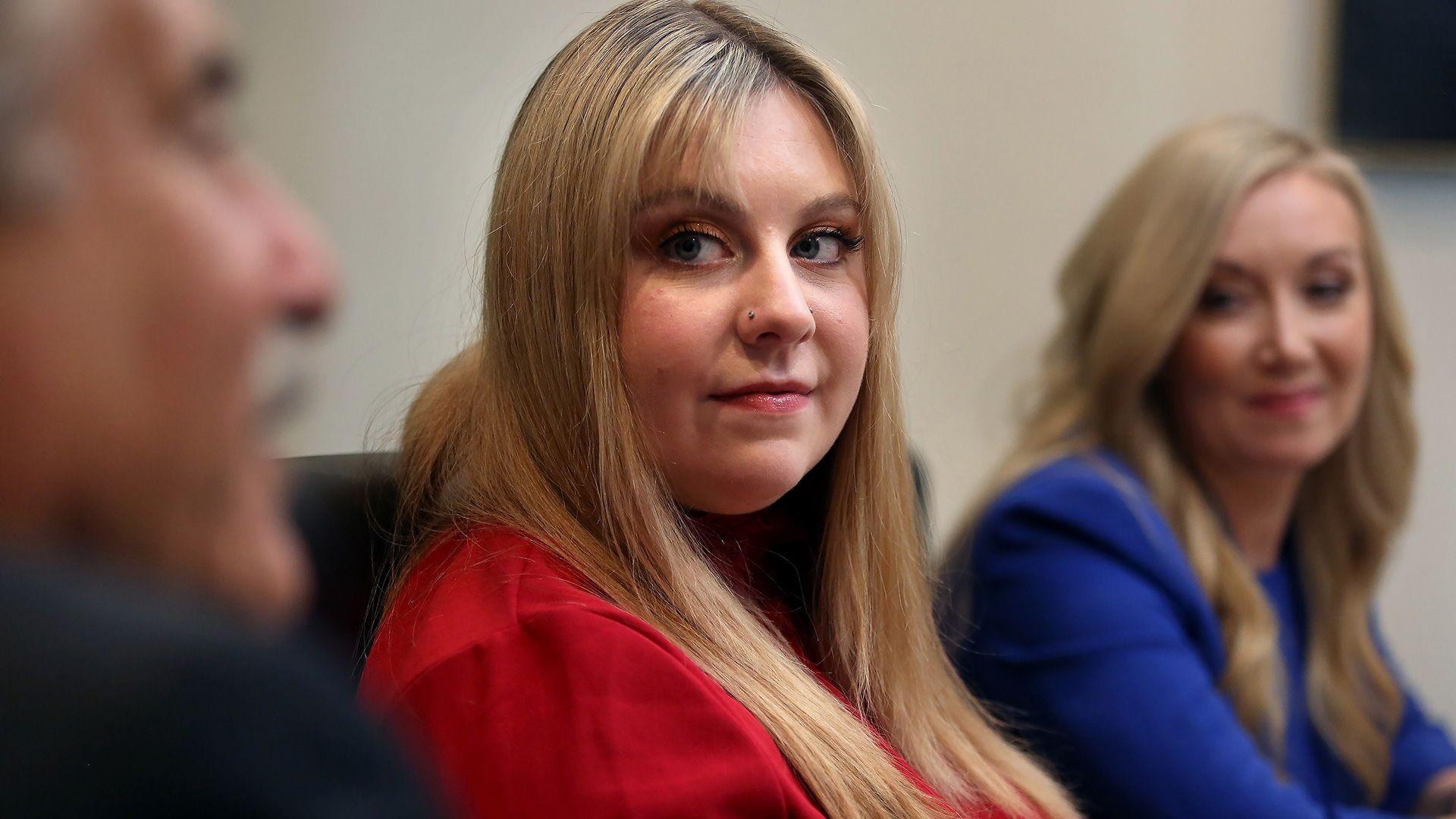 Abigail Zwerner, the teacher who was shot at Richneck Elementary School last year, listens as one of her attorneys talks to a reporter on 03 January, 2024