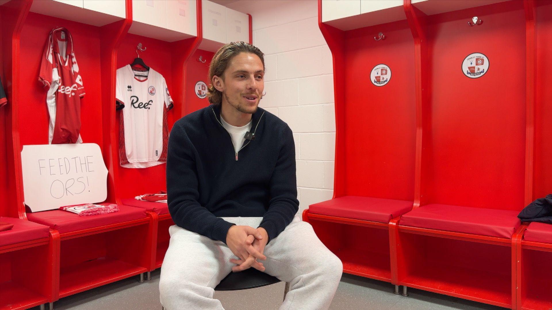 Danilo Orsi sat in the dressing room at Crawley, surrounded by red shirts