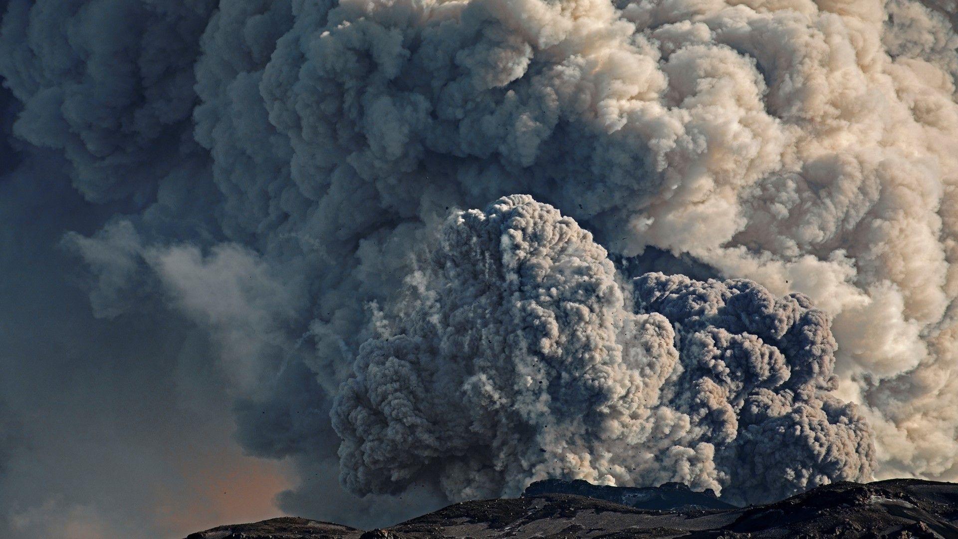 Ash cloud erupting from a volcano 