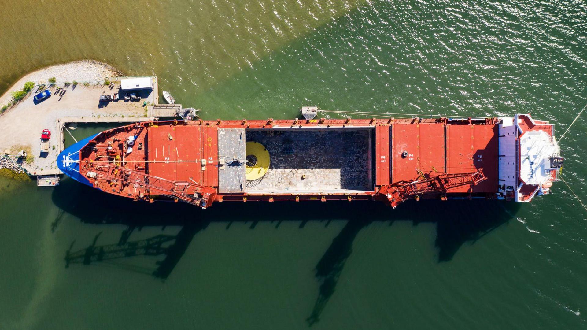 An aerial view of an industrial cable laying vessel