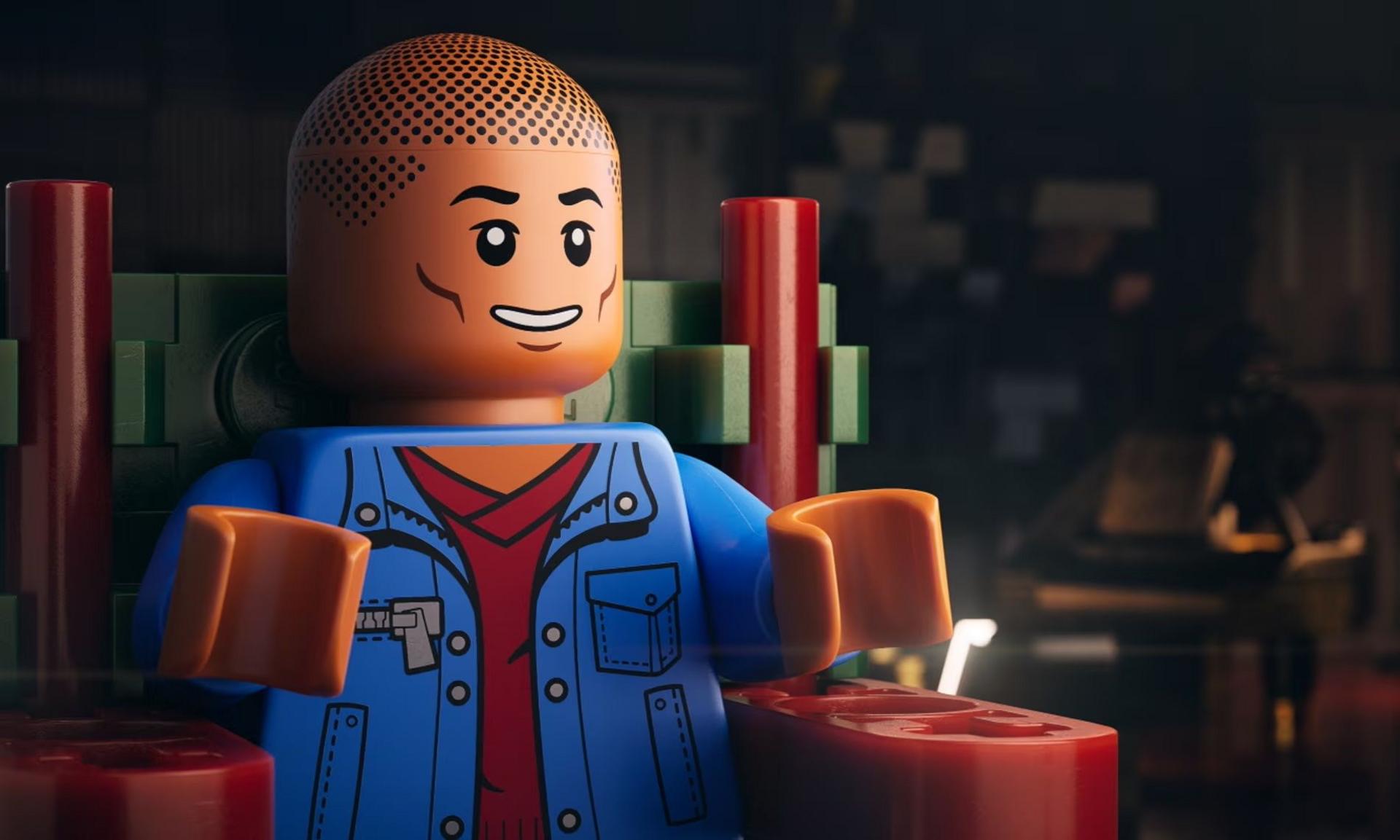 Pharrell Williams, as a Lego minifigure, being interviewed for the documentary Piece By Piece. He is wearing a blue denim jacket.