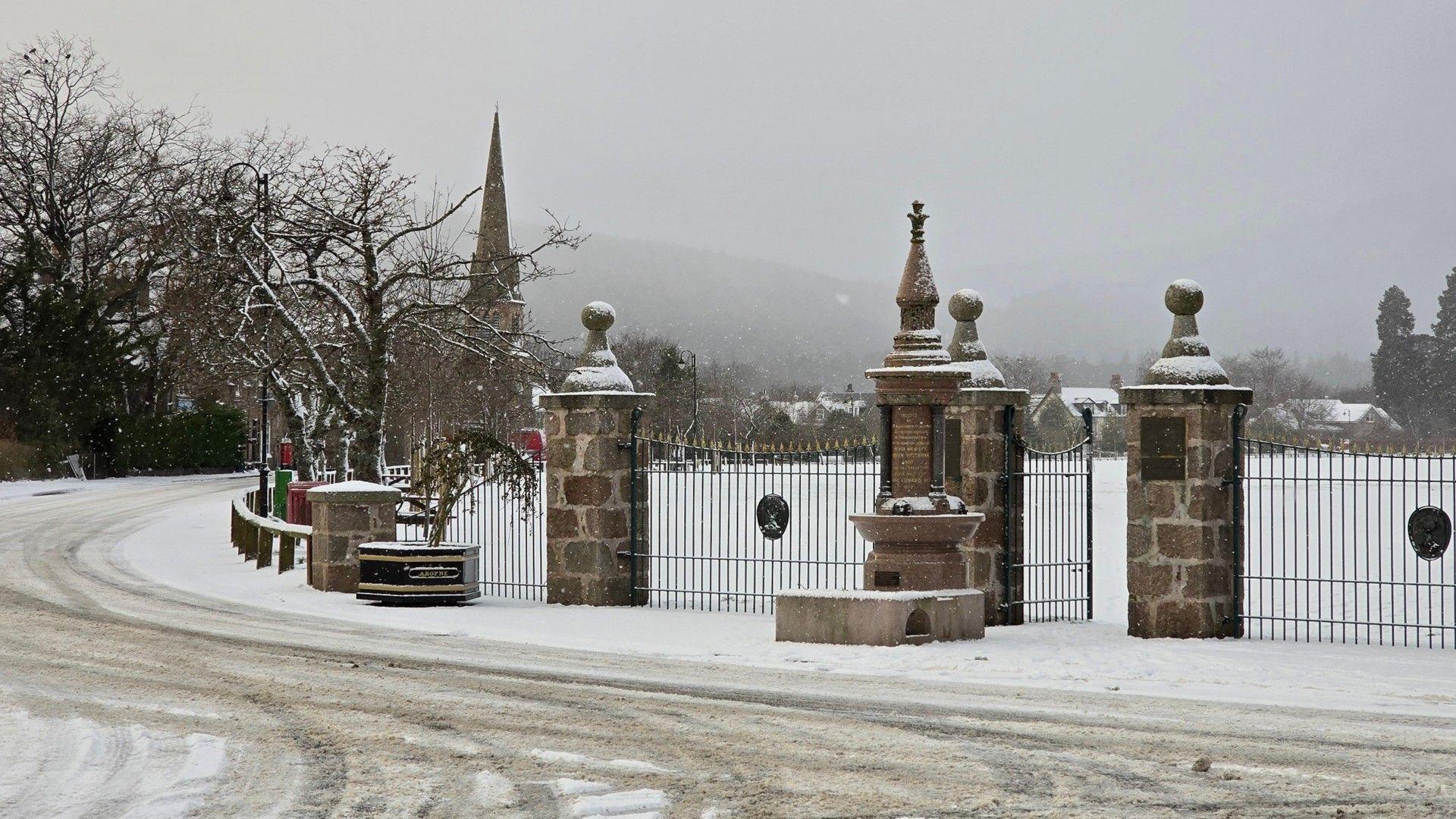 Snow covered trees and urban park in Aboyne
