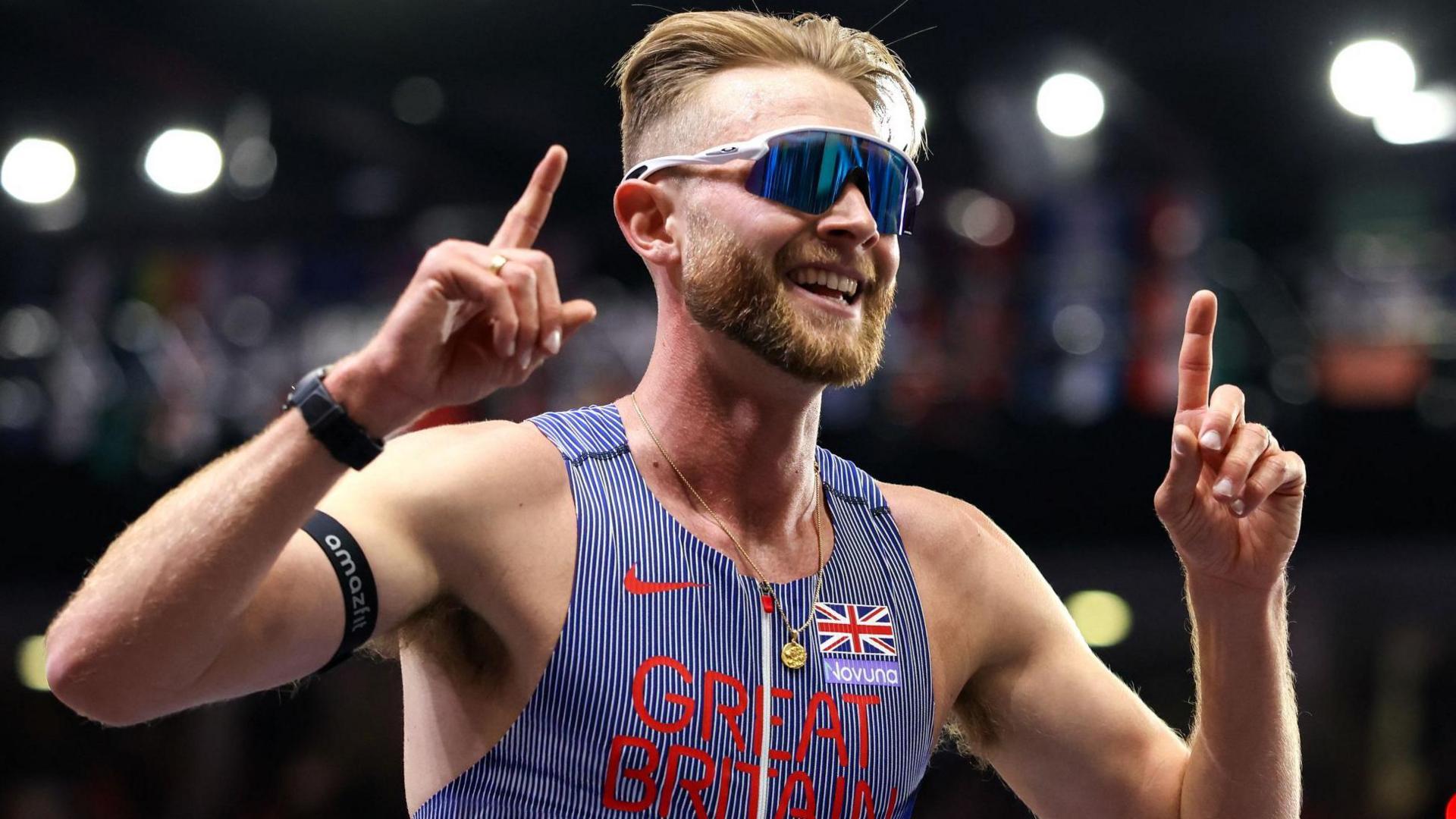 Josh Kerr celebrates winning world indoor 3,000m gold