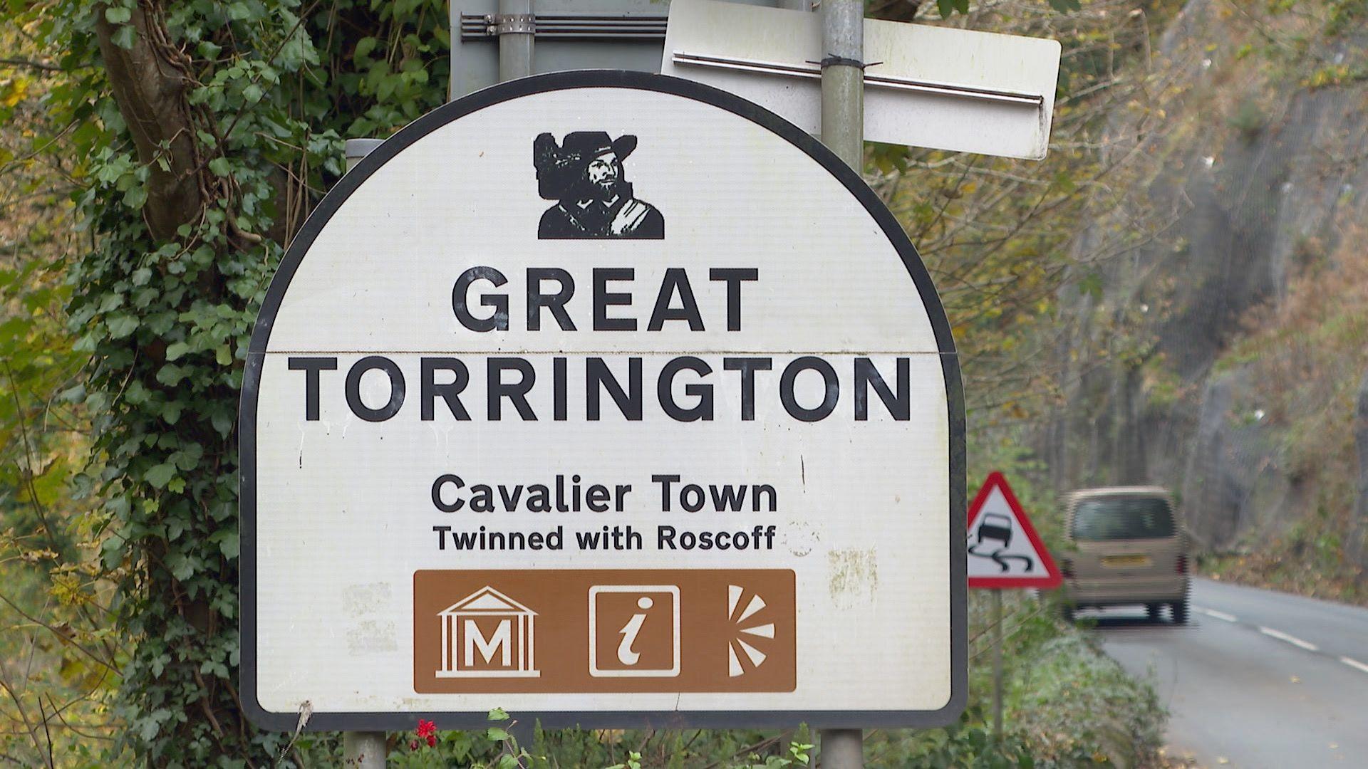 Road sign saying Great Torrington, Cavalier Town, Twinned with Roscoff