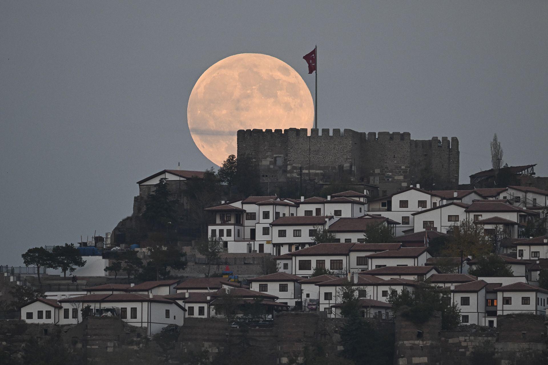 The full moon, also known as 'Beaver Moon', rises behind the Ankara Castle in Ankara, Turkey on November 05, 2025.