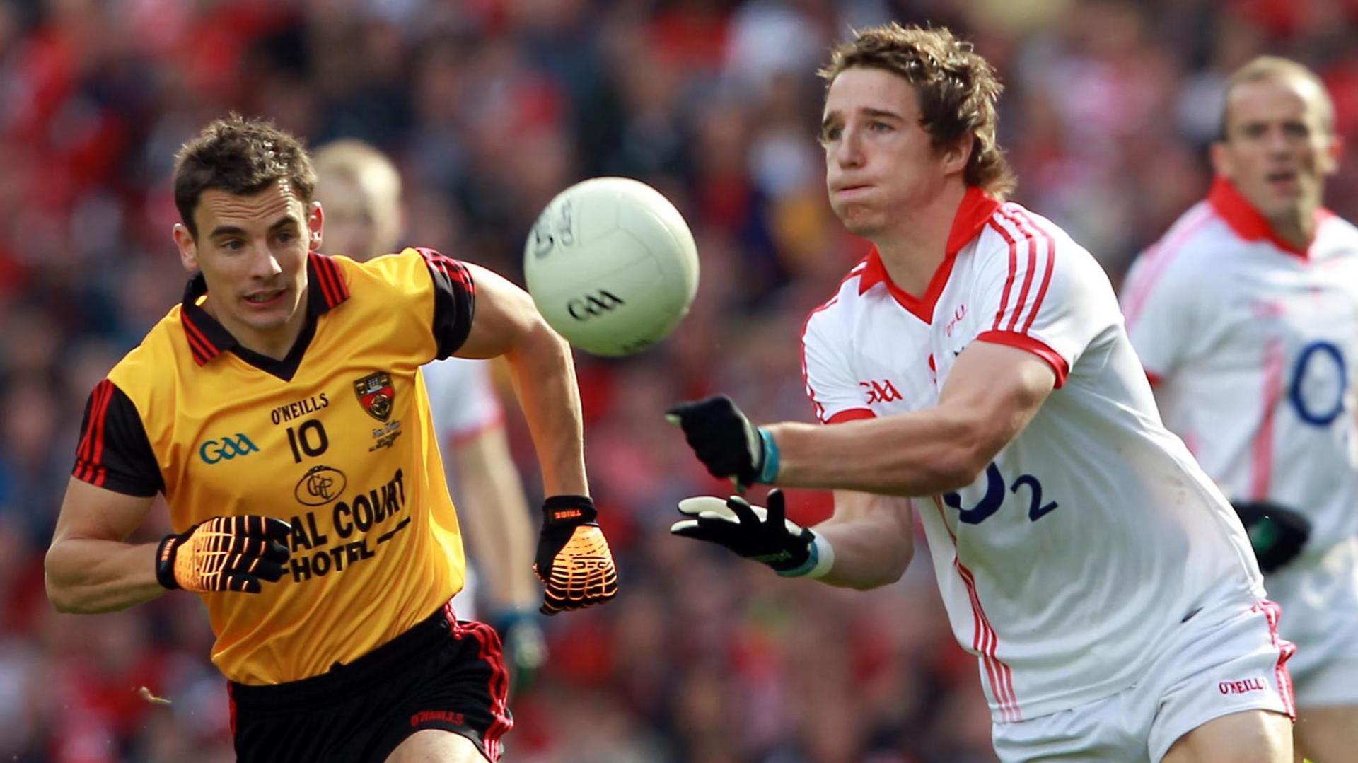 Down's Danny Hughes closes in on Aidan Walsh during the 2010 All-Ireland final