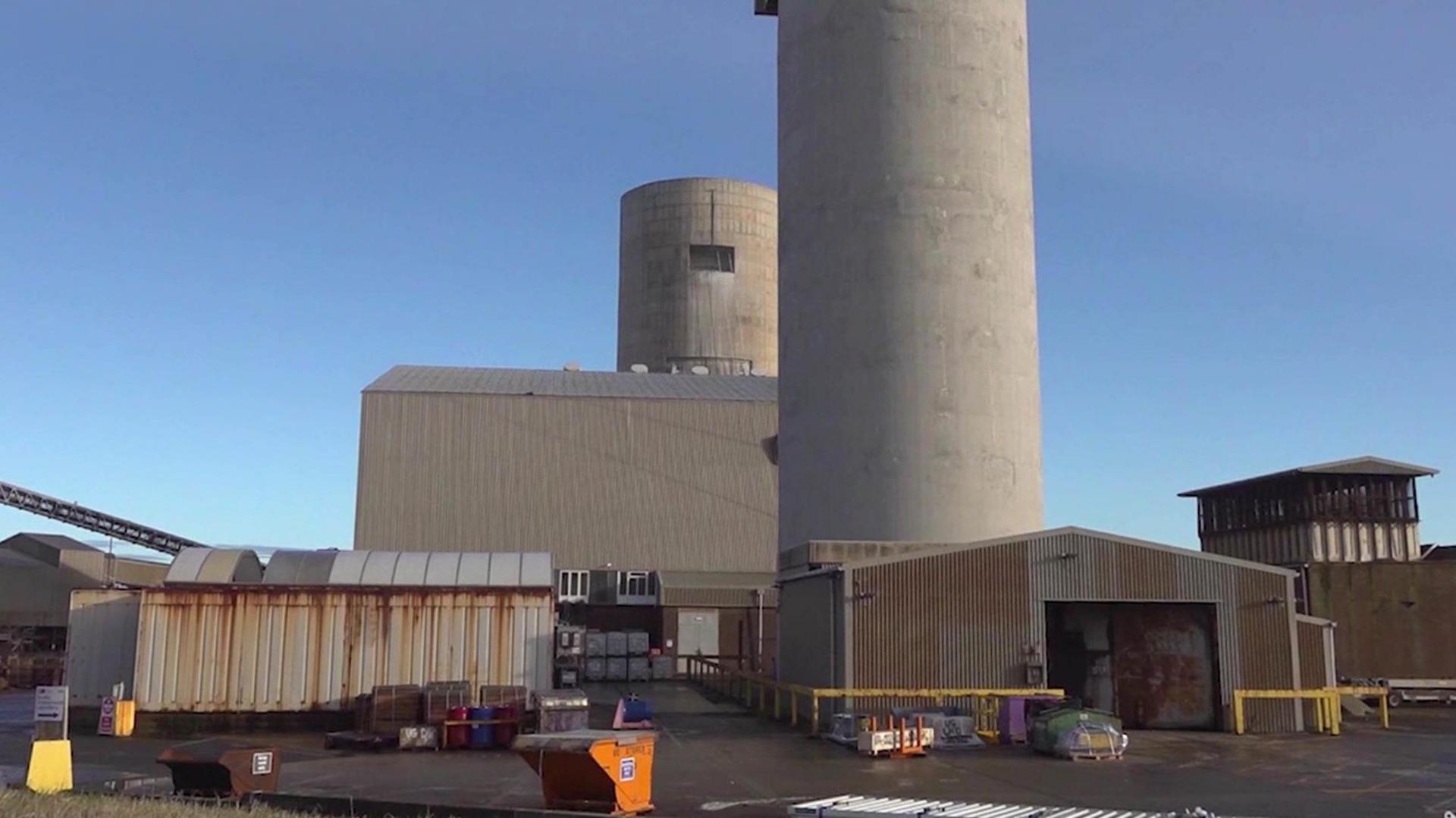 A picture showing the outside of Boulby Mine in North Yorkshire. There are several buildings with two large round shaped buildings standing higher than the rest.