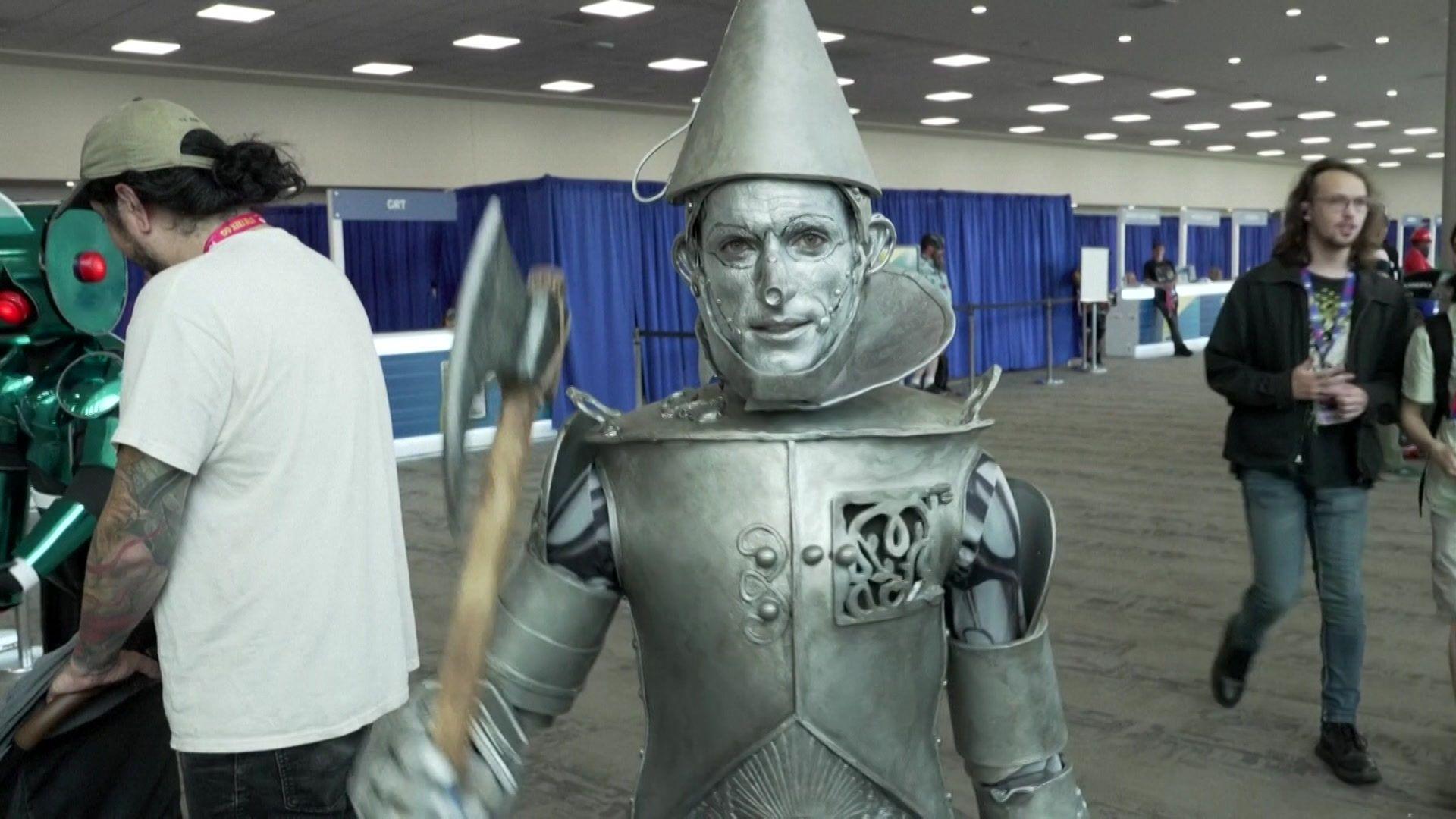 A man wearing a Tin Man costume from the Wizard of Oz