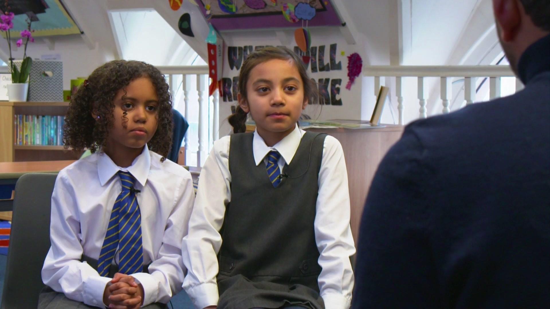 school children speaking to Ricky Boleto