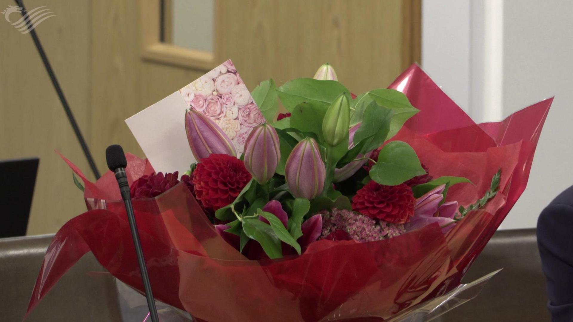 A bouquet of flowers on the Hefin David desk