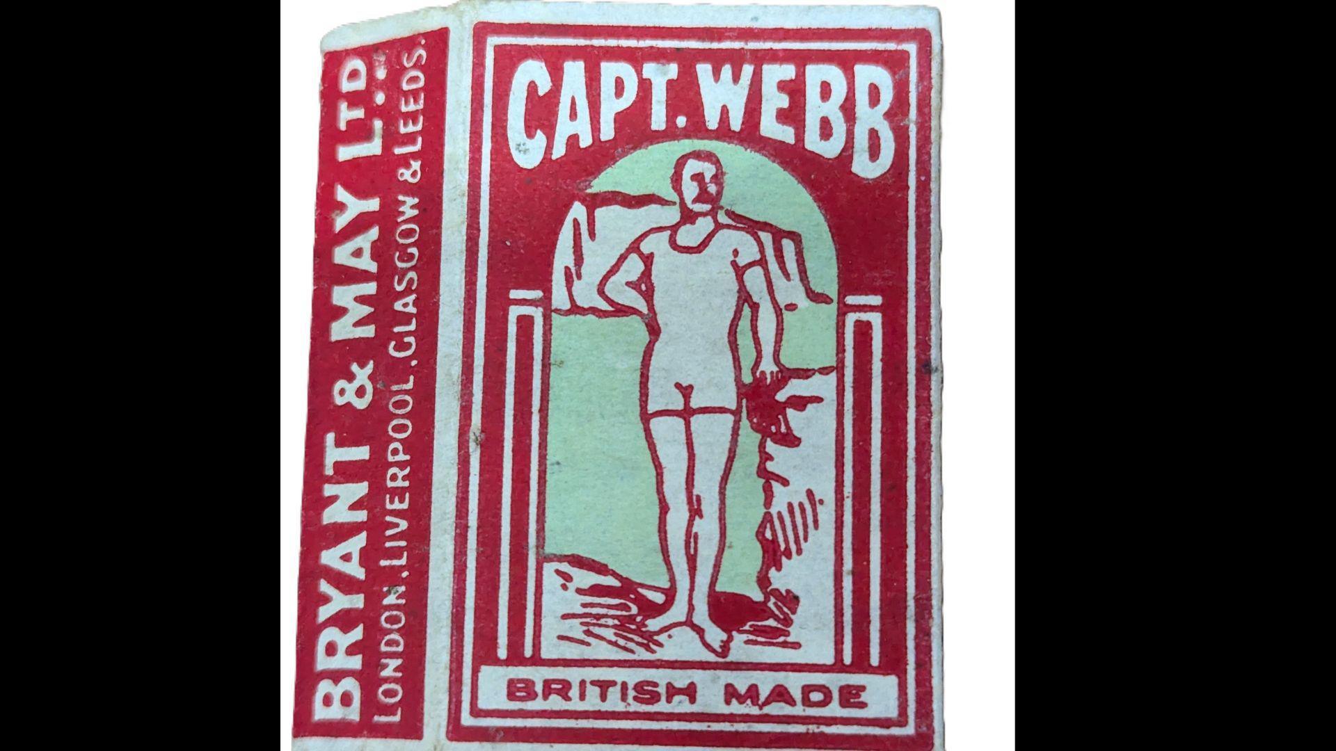 A vintage red and white matchbox featuring Captain Matthew Webb.