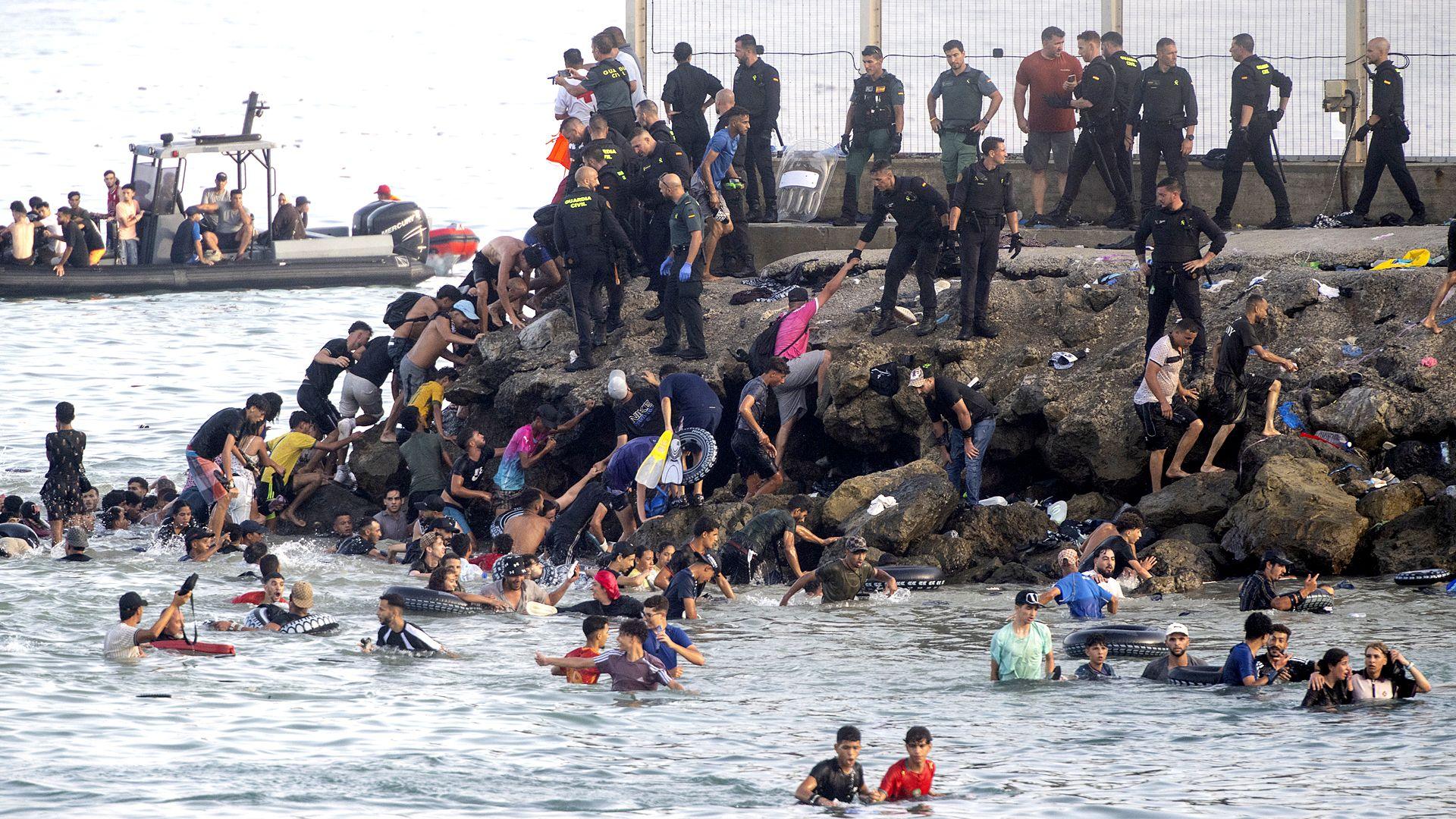 migrants swimming into Ceuta