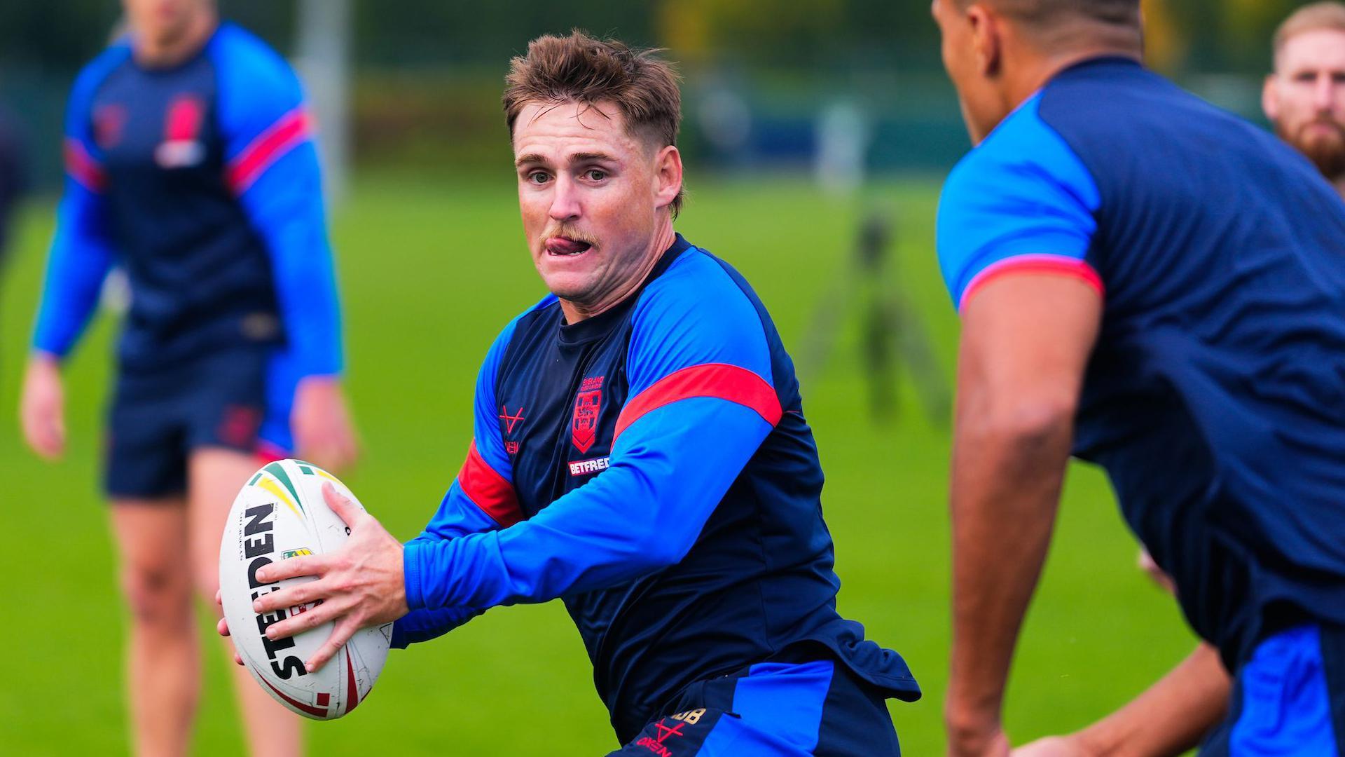 AJ Brimson looks to pop a pass to Kai Pearce-Paul who is moving up close by for a ball