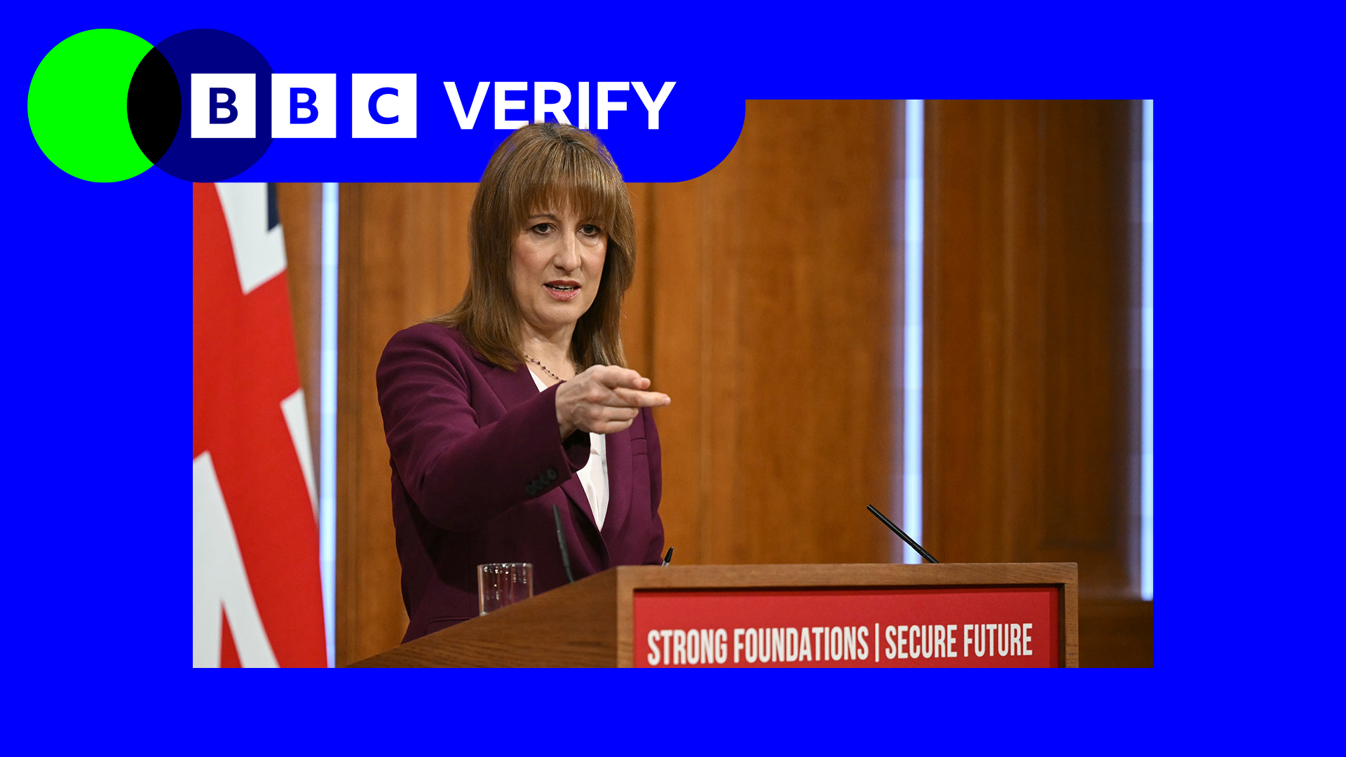 Rachel Reeves stands at a podium bearing the message, 'Strong foundations, secure future'