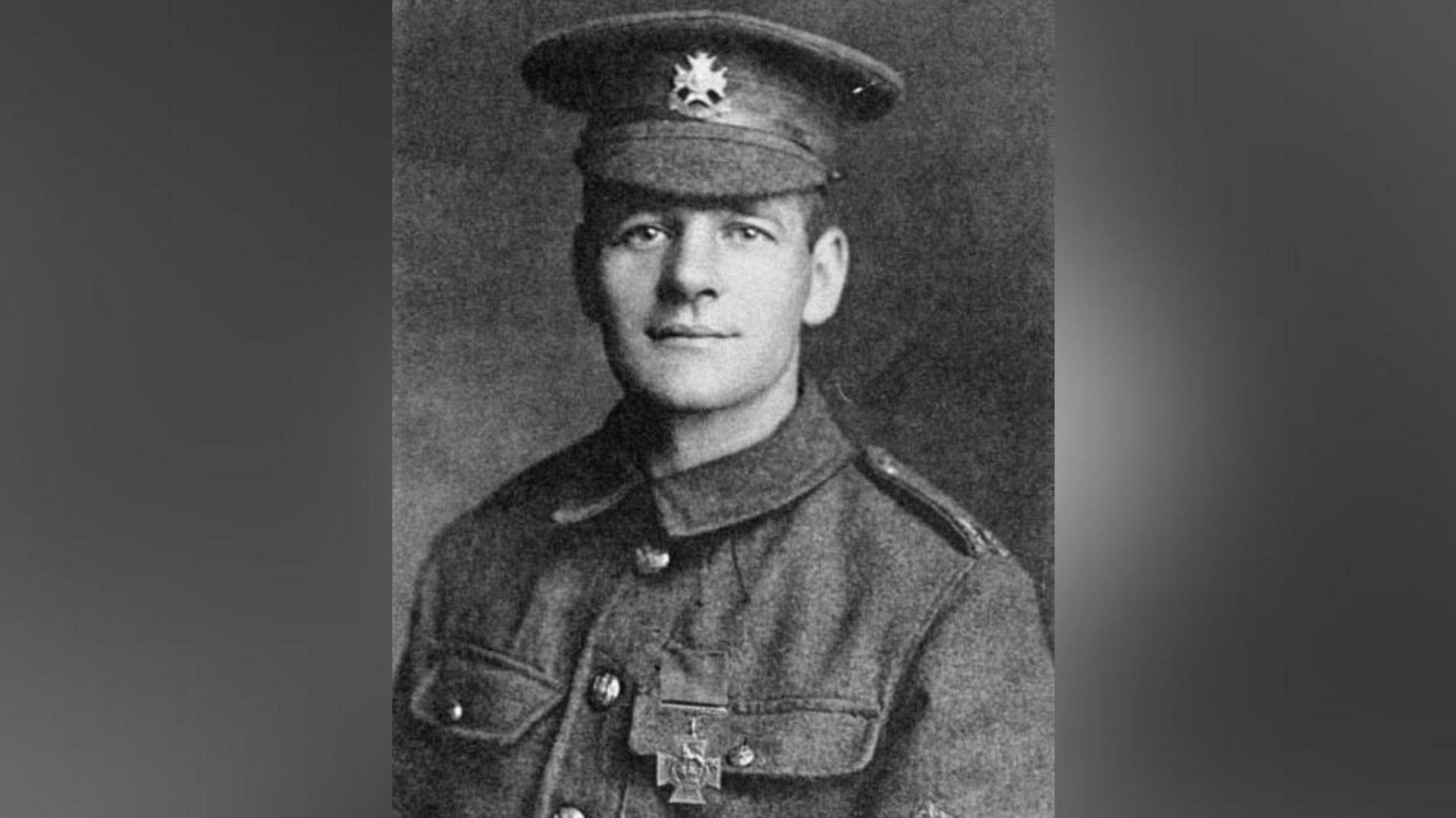 A black and white photo of the soldier wearing his Victoria Cross pinned to his uniform