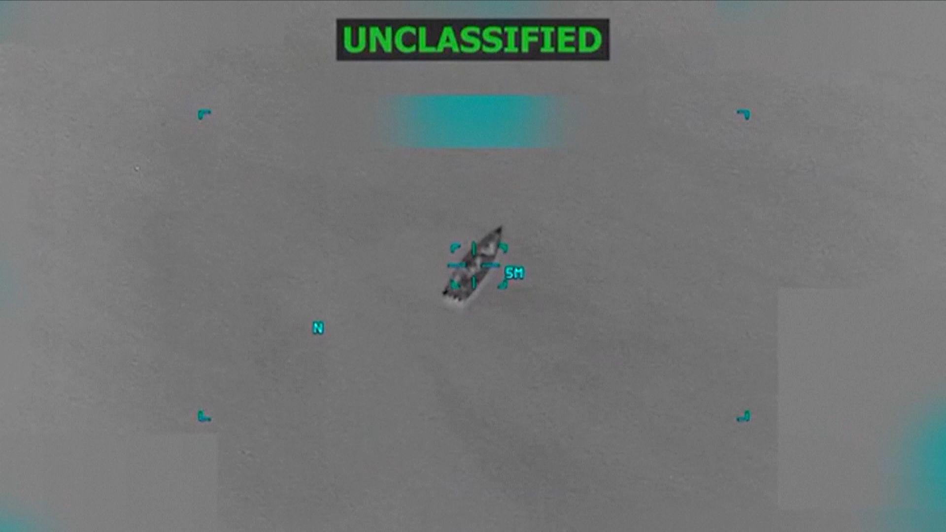 A ship outline is shown in black and white under the word "unclassified"