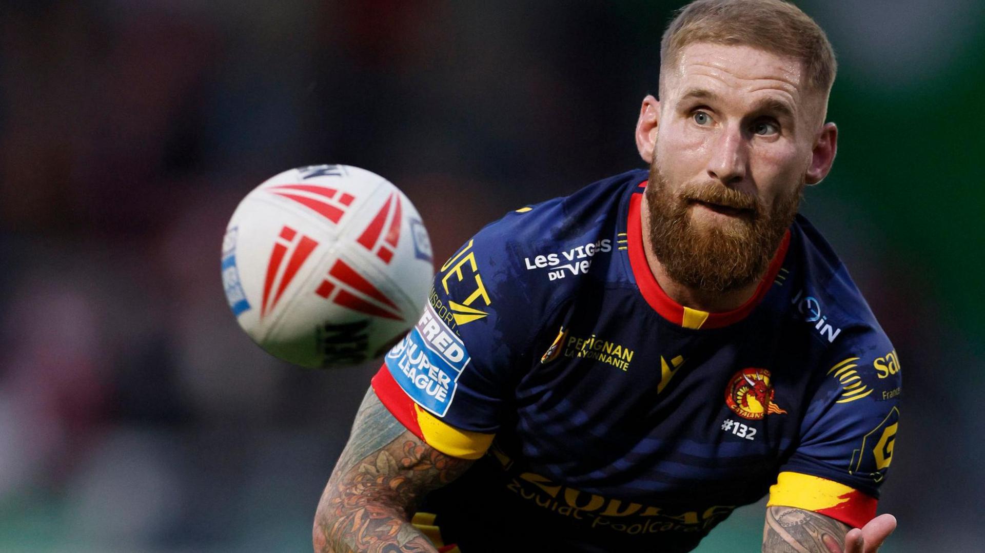 Sam Tomkins catches a ball while playing for Catalans Dragons