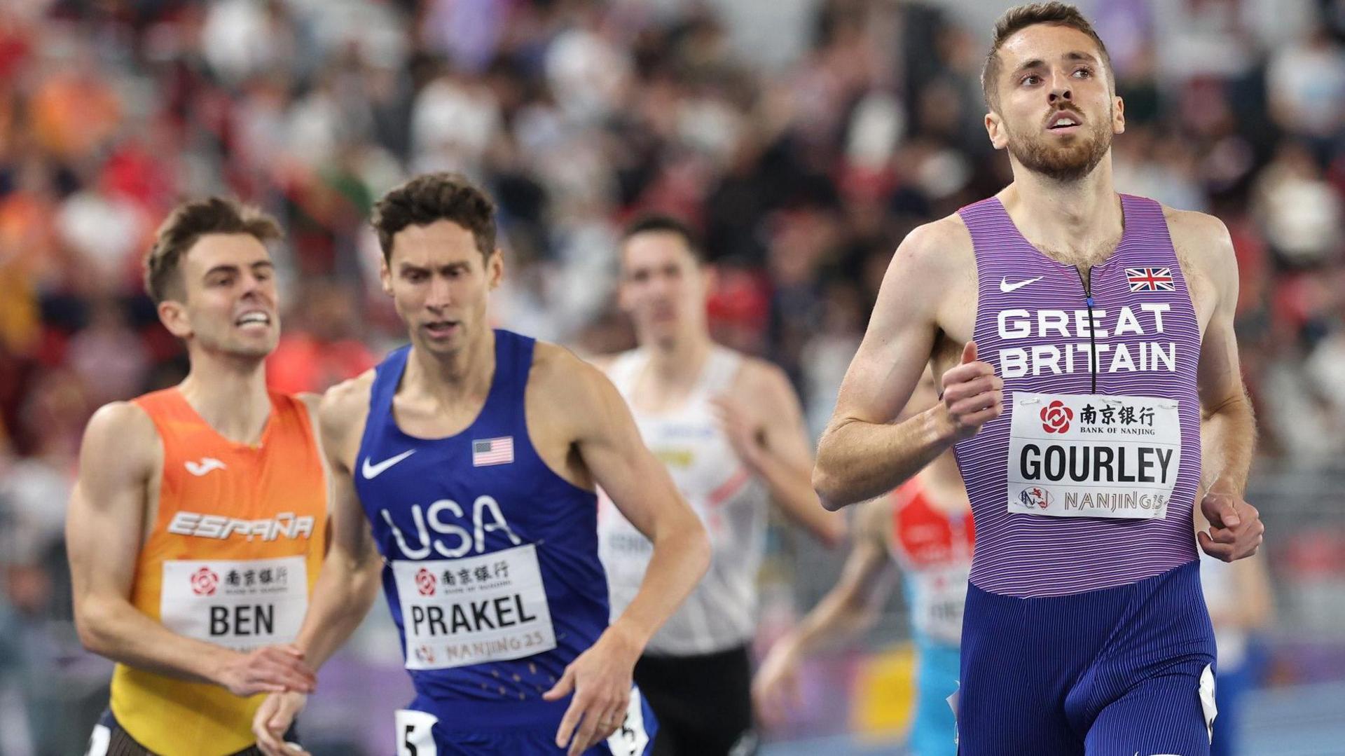 Neil Gourley (right) wins his heat in China