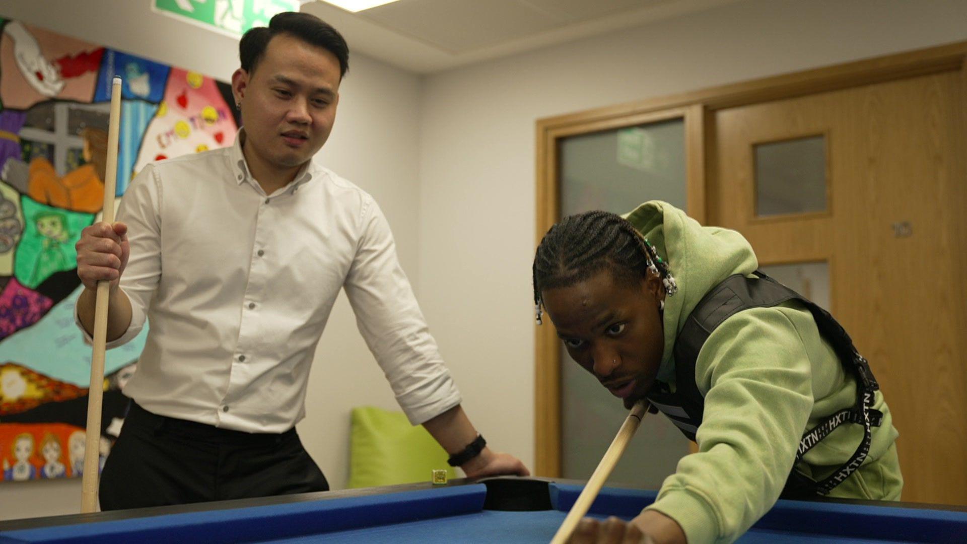 Boy and Alex playing pool