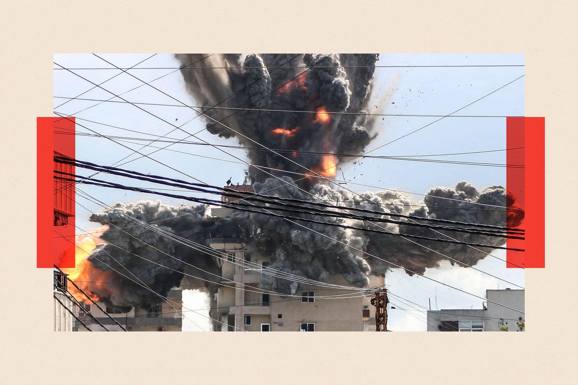 A fireball rises from a building hit by an Israeli airstrike in the area of Abbasiyeh, on the outskirts of the southern Lebanese city of Tyr

