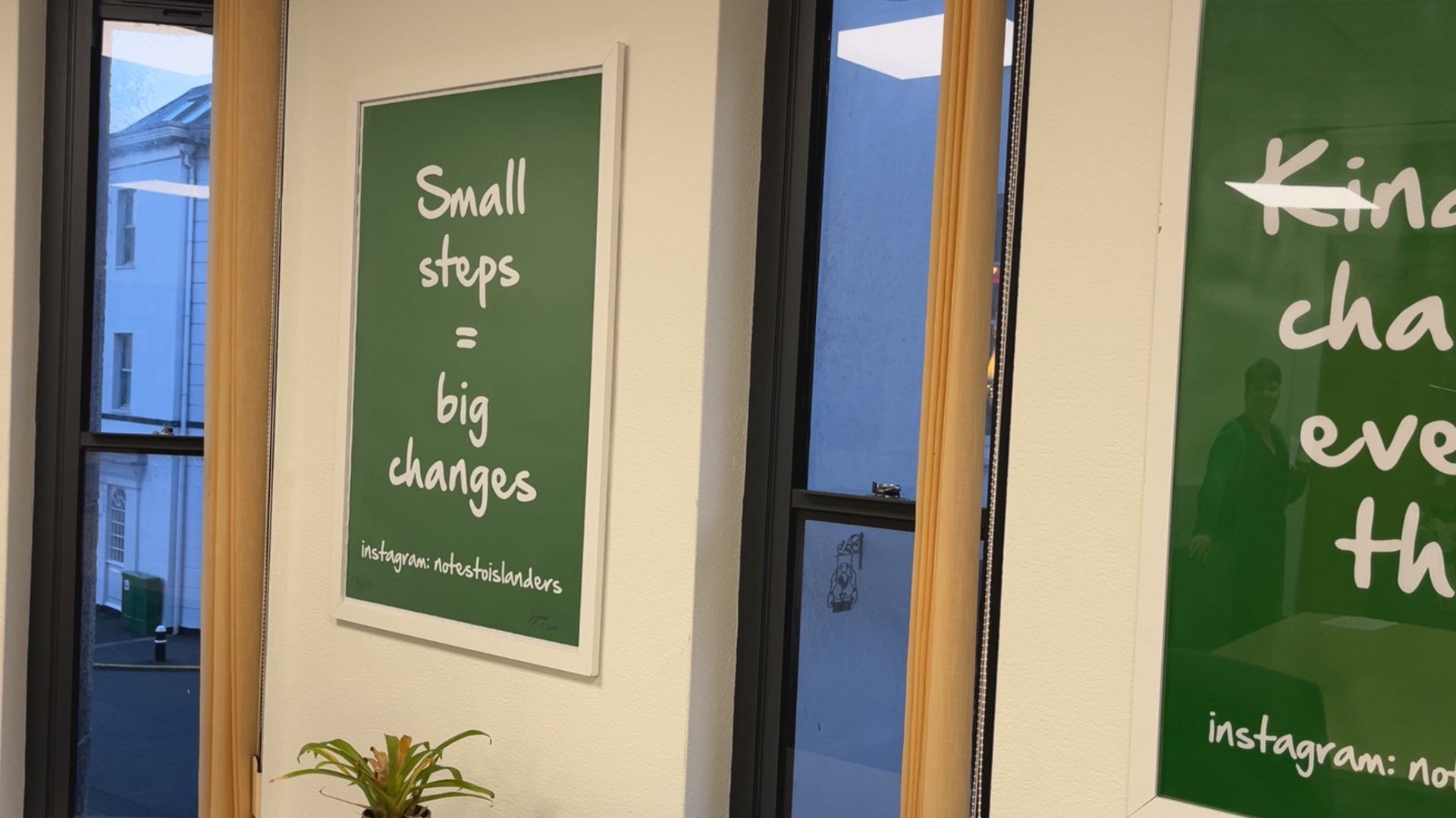 A green sign which says 'Small steps = big changes"