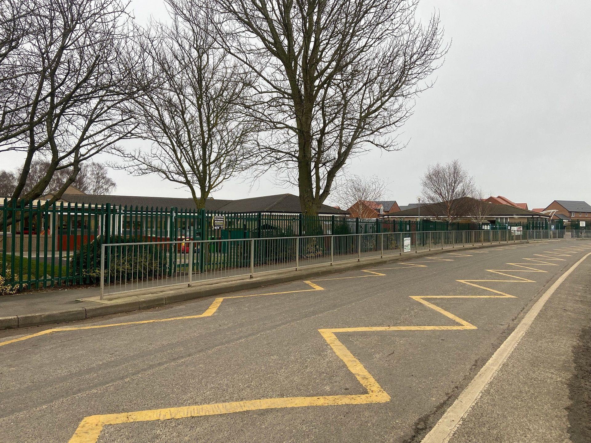 road with yellow marking and railings