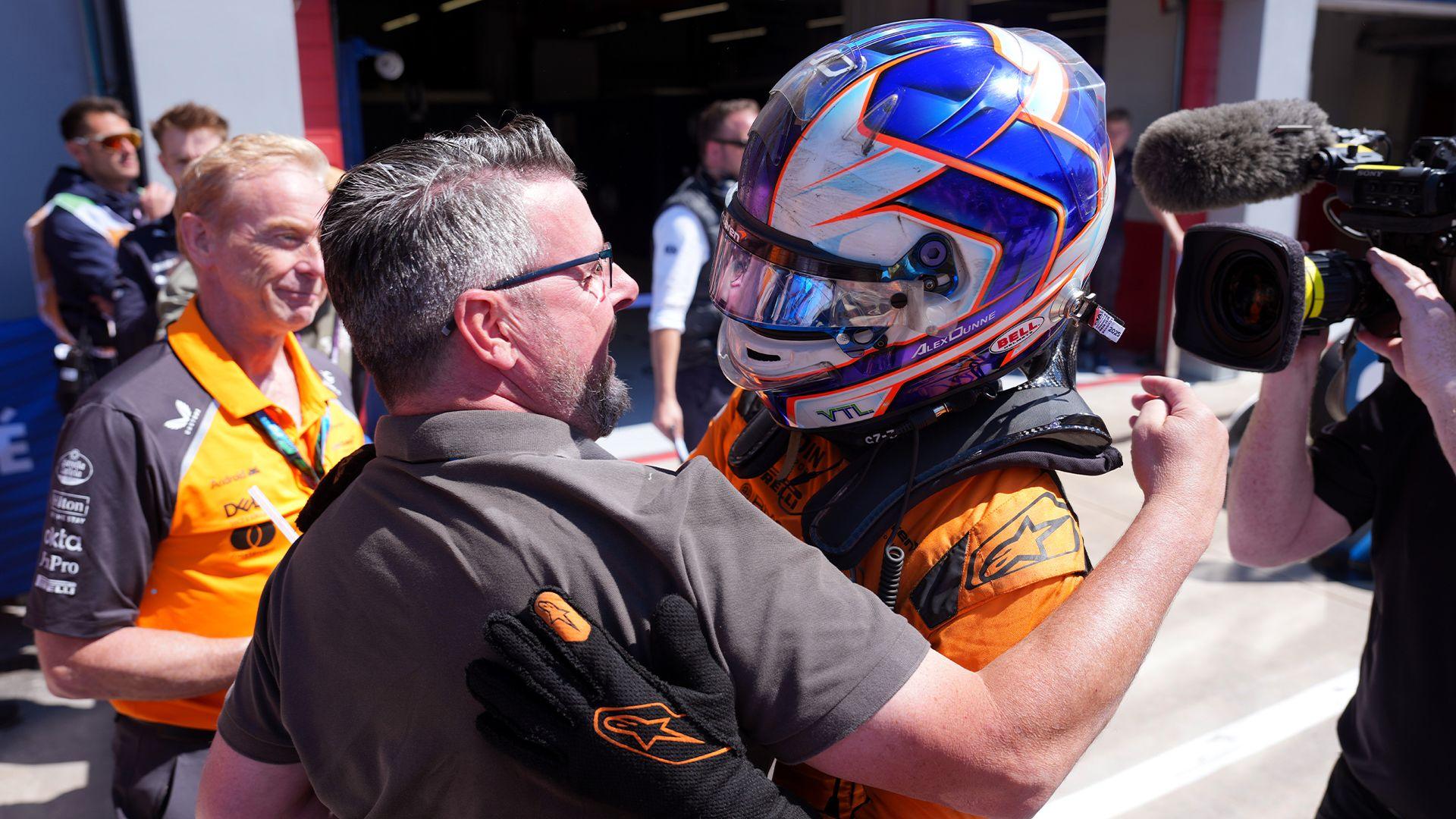 Noel Dunne hugs Alex Dunne after a victory at Imola