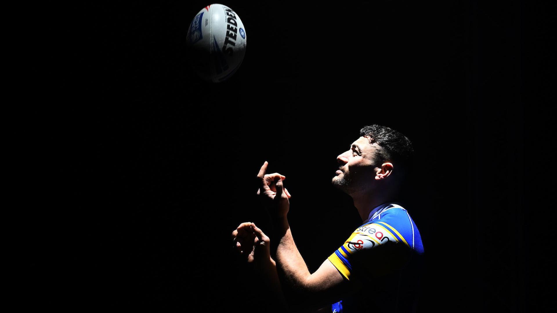 Jake Connor gazes upwards as a rugby ball he spun flights up into the air.