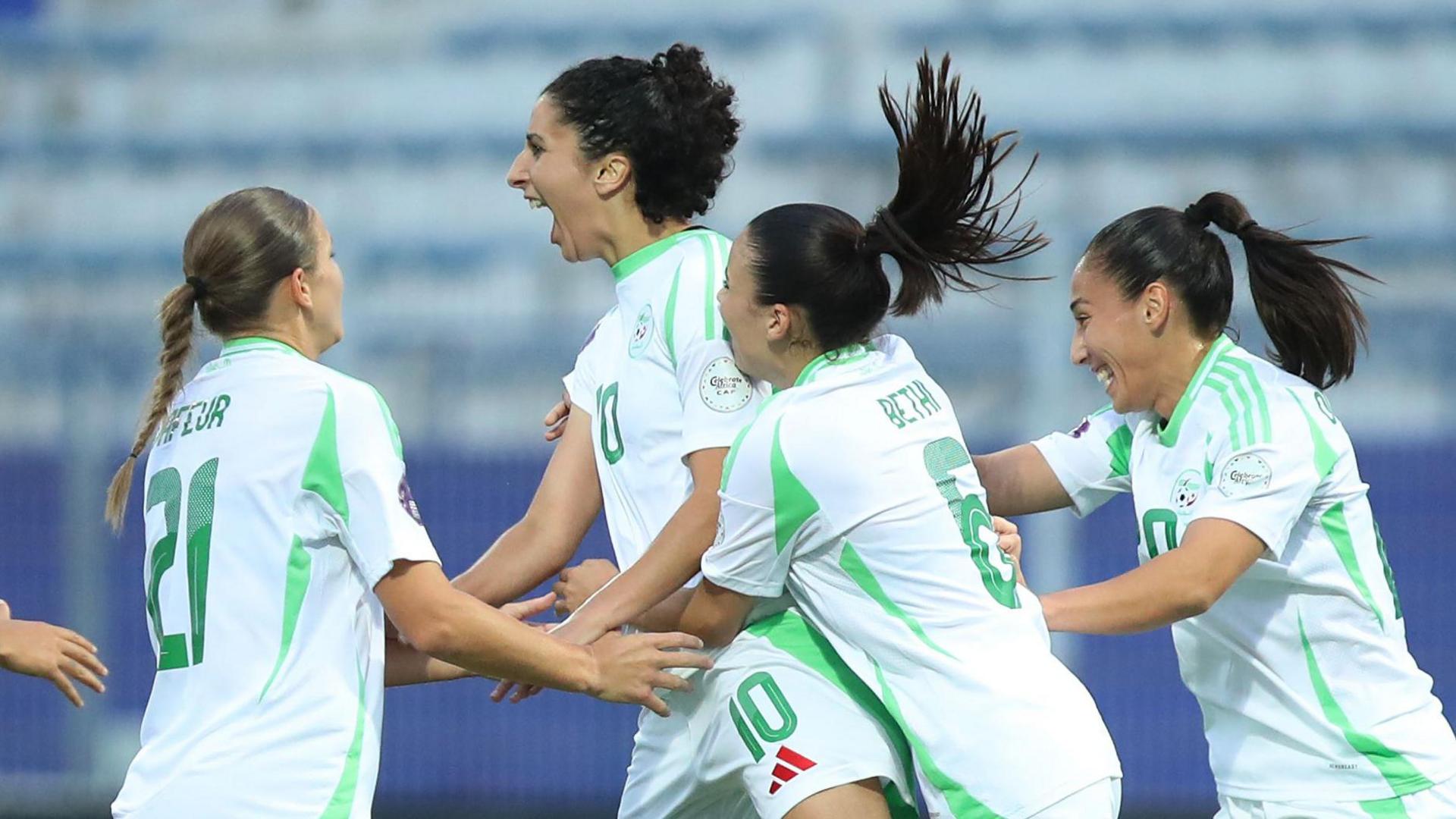 Ghoutia Karchouni (second left) celebrates with her Algeria team-mates after scoring at the Women's Africa Cup of Nations