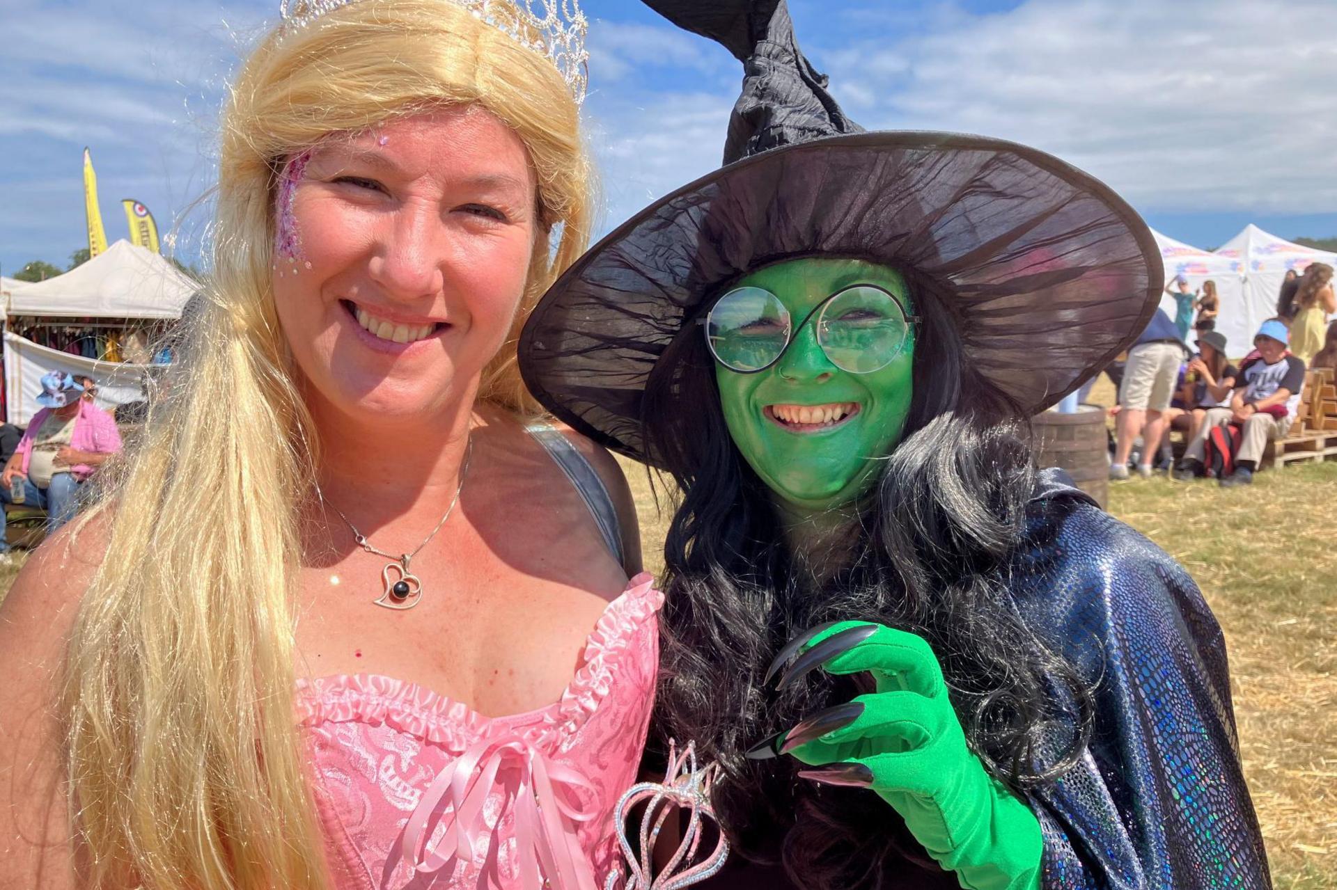 Festival-goers dressed as Wicked's main characters.