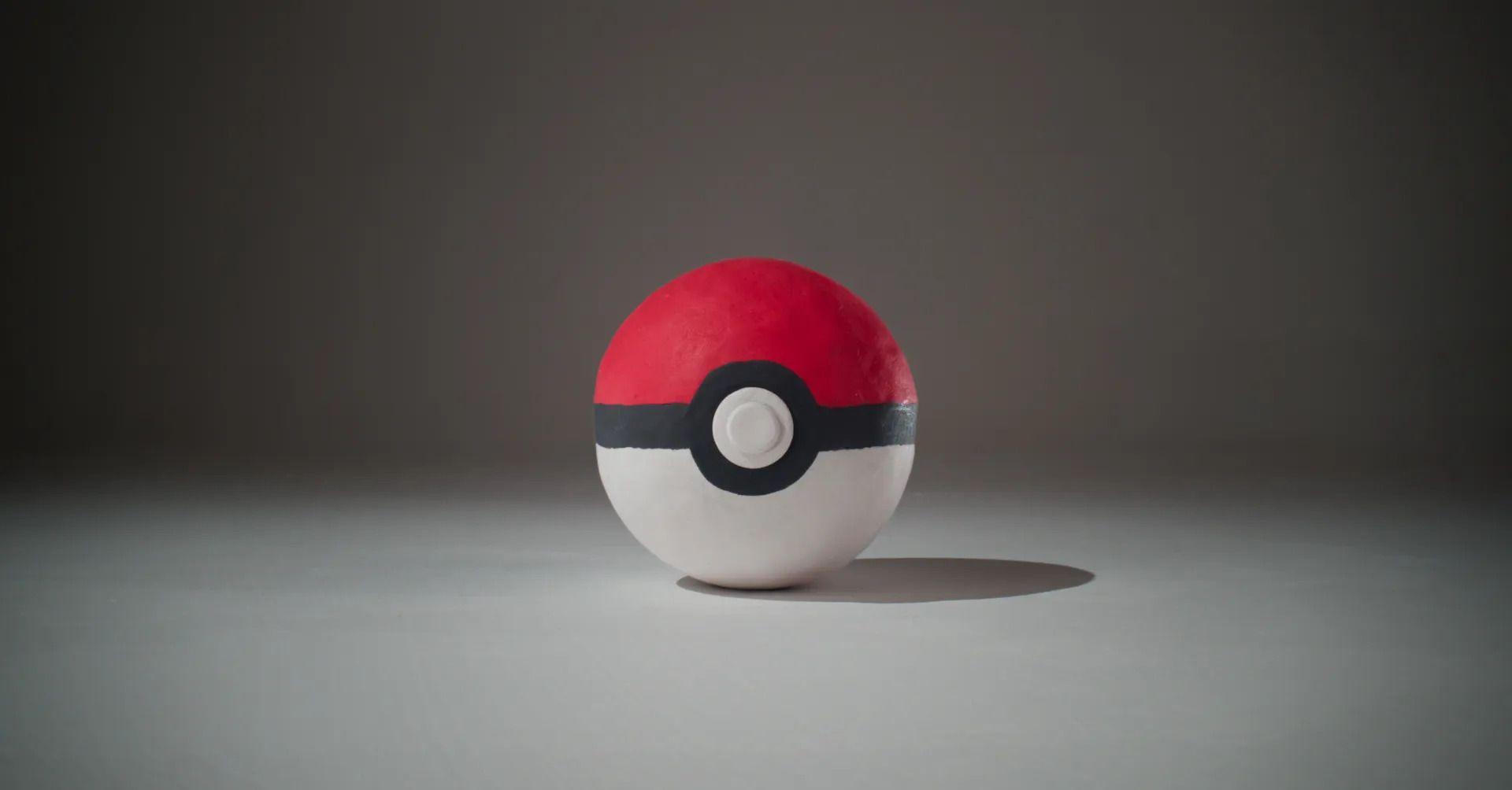 a plasticine version of the famous pokeball done in a classic aardman animations style on a plain background