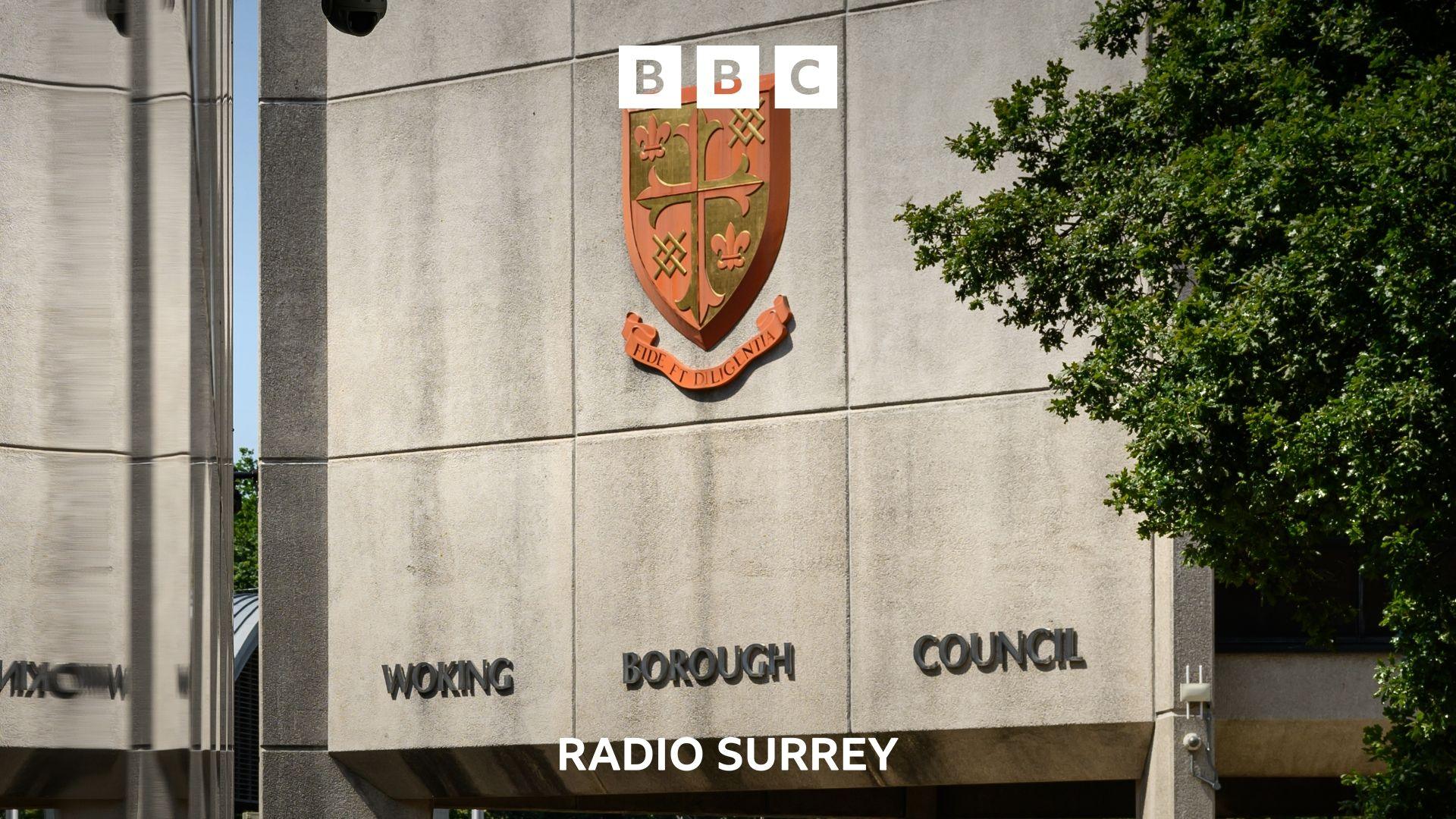 A concrete building displaying the logo and name of Woking Borough Council. 