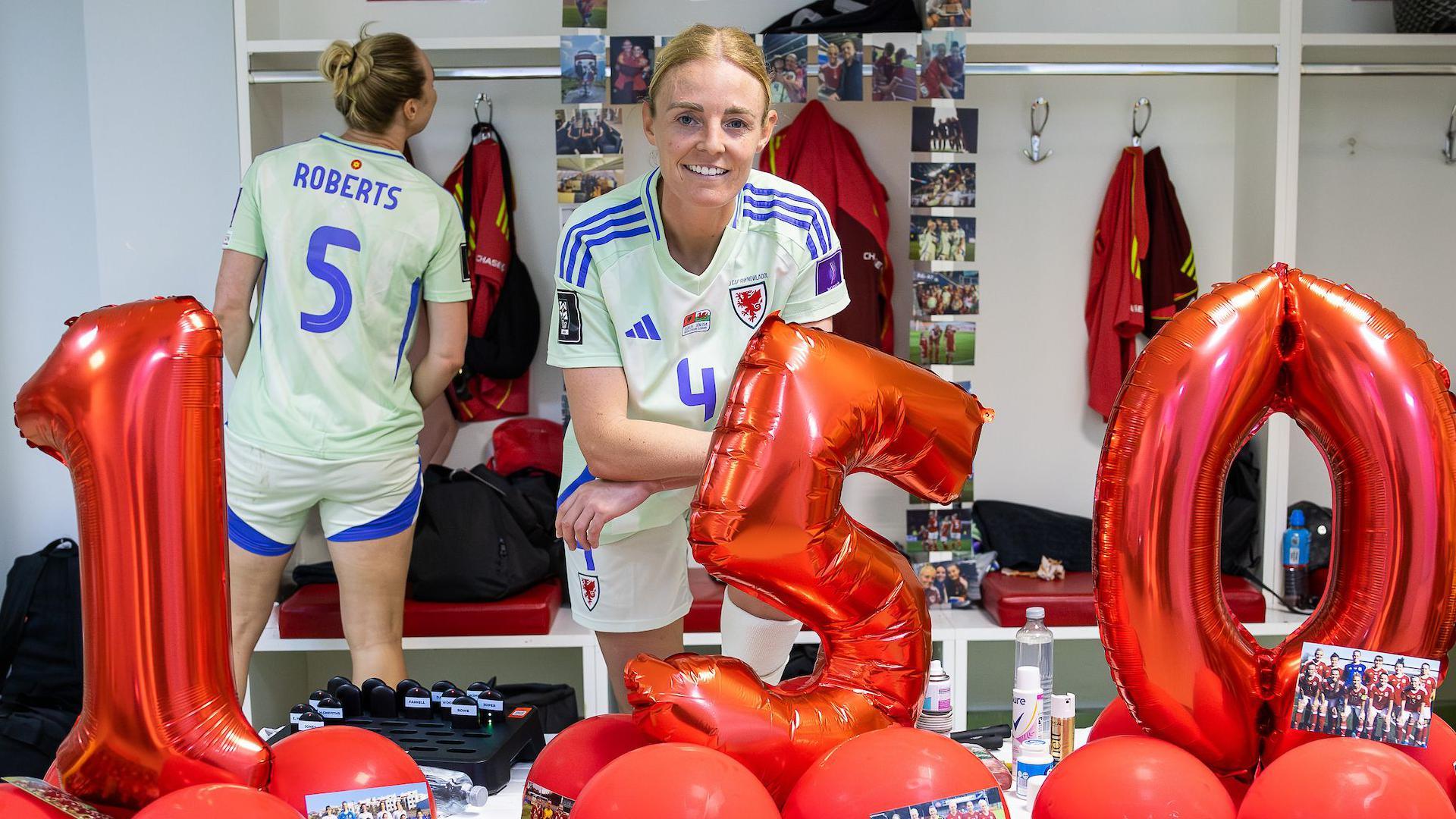 Sophie Ingle with numbered balloons spelling out 150 in the Wales dressing room in Albania 