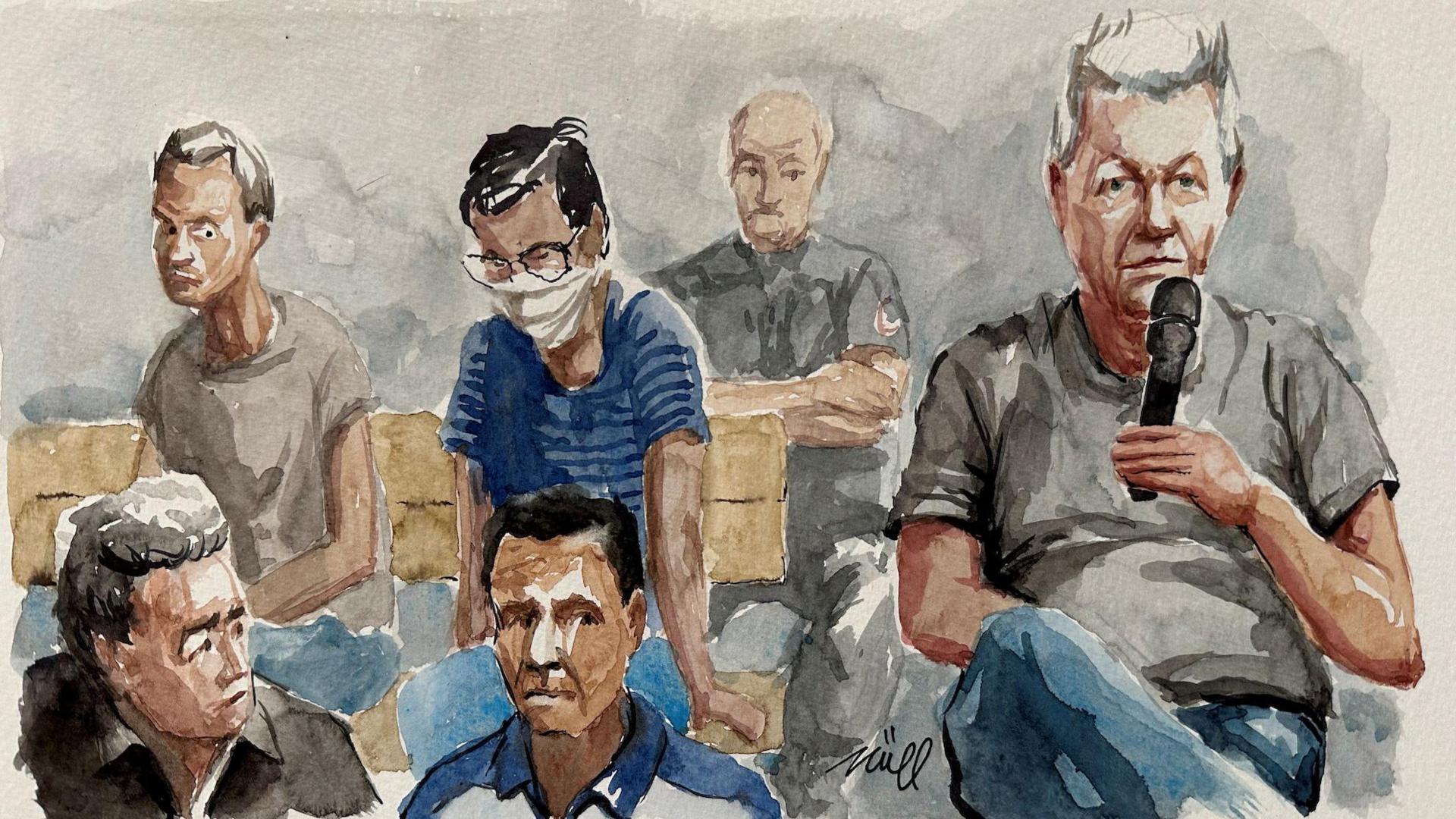 A court sketch depicting Dominique Pelicot on the right hand side, a man with grey hair, wearing a grey T-shirt and blue trousers, sitting up straight and holding a microphone. Behind him is a uniformed man standing guard and four other men, with uncertain expressions of their faces or hanging their heads, who may be some of the co-defendants.