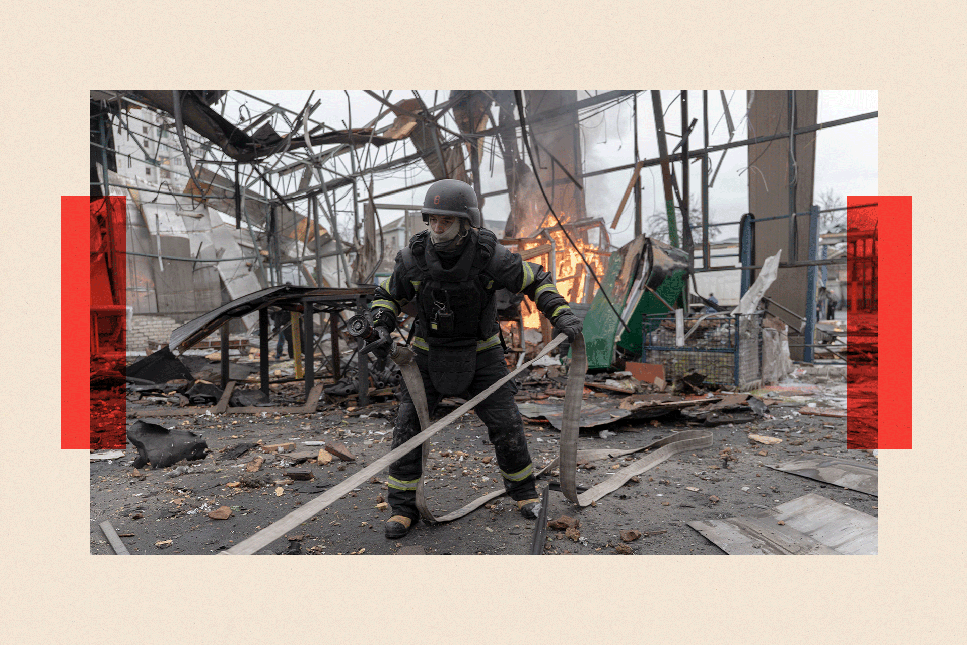 Emergency service workers in Ukraine attend a fire at a hangar destroyed by a drone strike