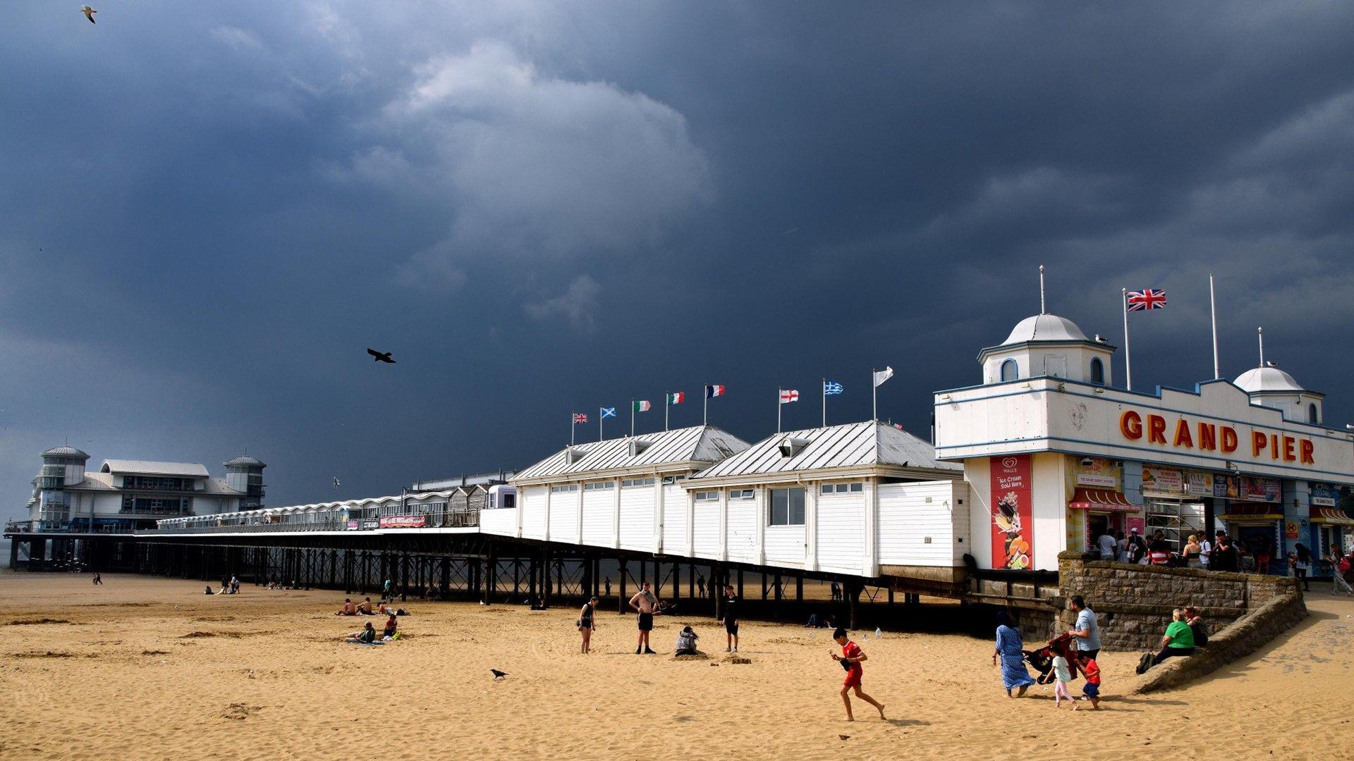 Dark clouds over a pier