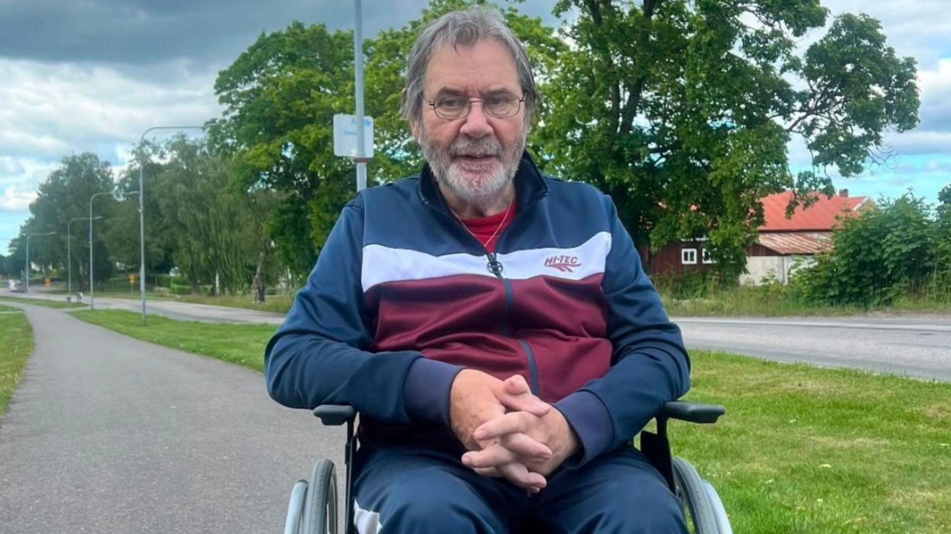 George Mason in a wheelchair