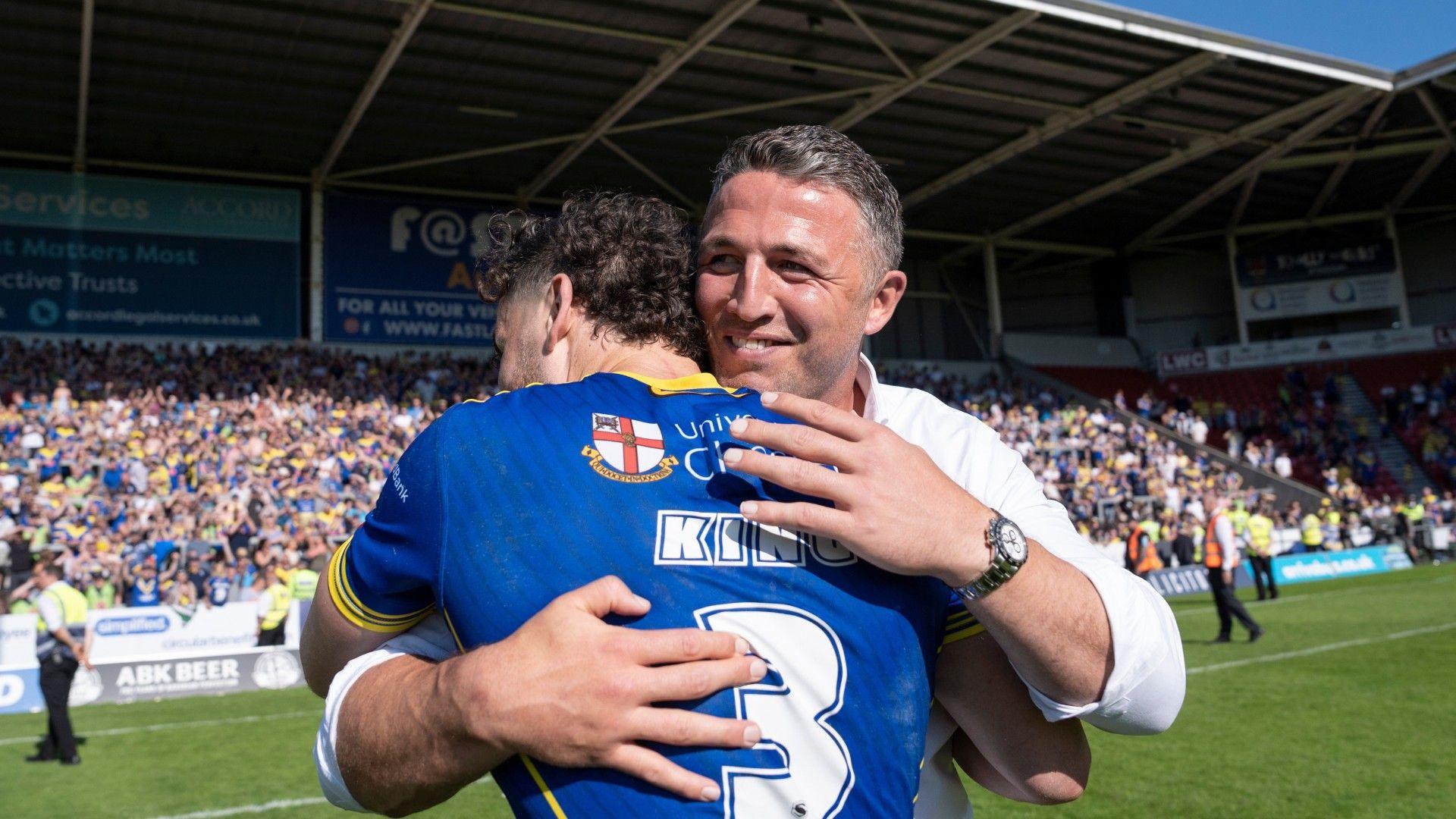 Warrington coach Sam Burgess gets a big hug from centre Toby King after the Challenge Cup semi-final win over Huddersfield.