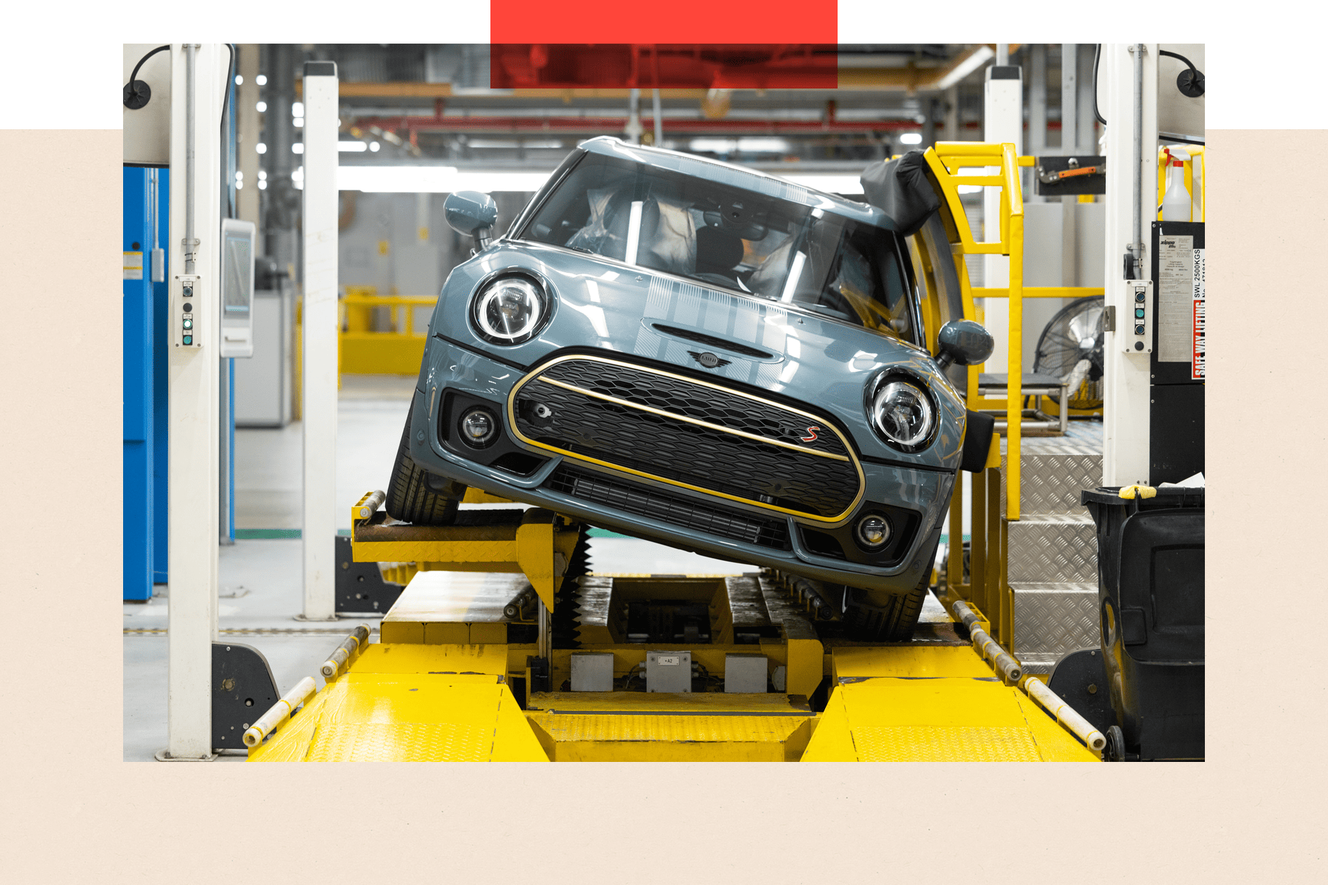 A Mini Cooper S car on the production line at a sideways angle