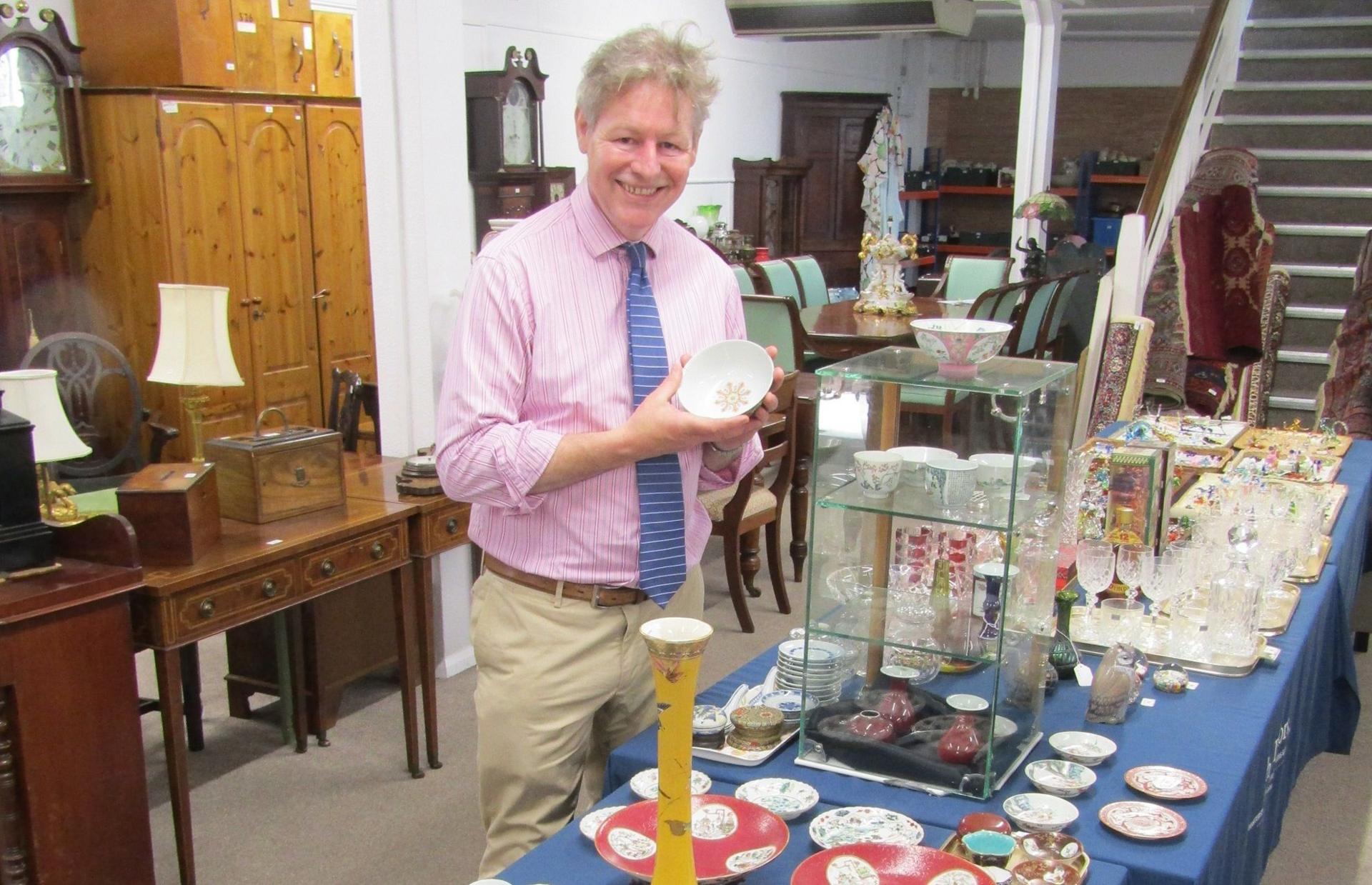 James Laverack with some of the porcelain sold at auction