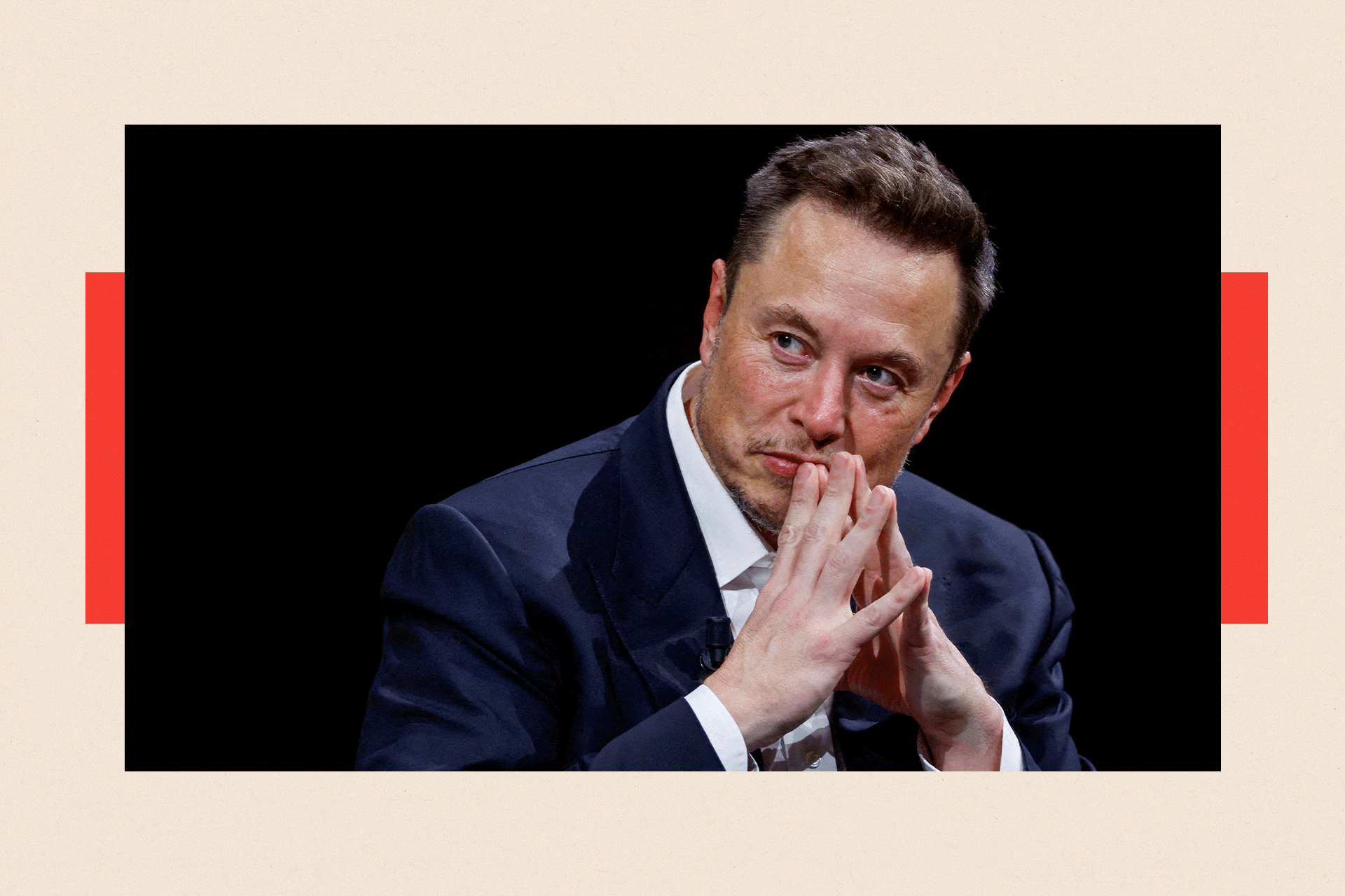 Elon Musk with his hands by his mouth