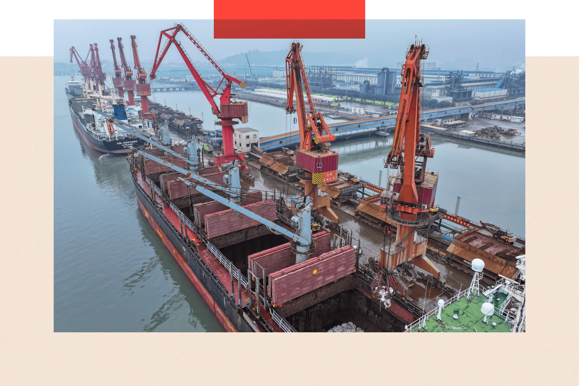 A ship carrying tons of nickel ore carries out loading and unloading operations in China
